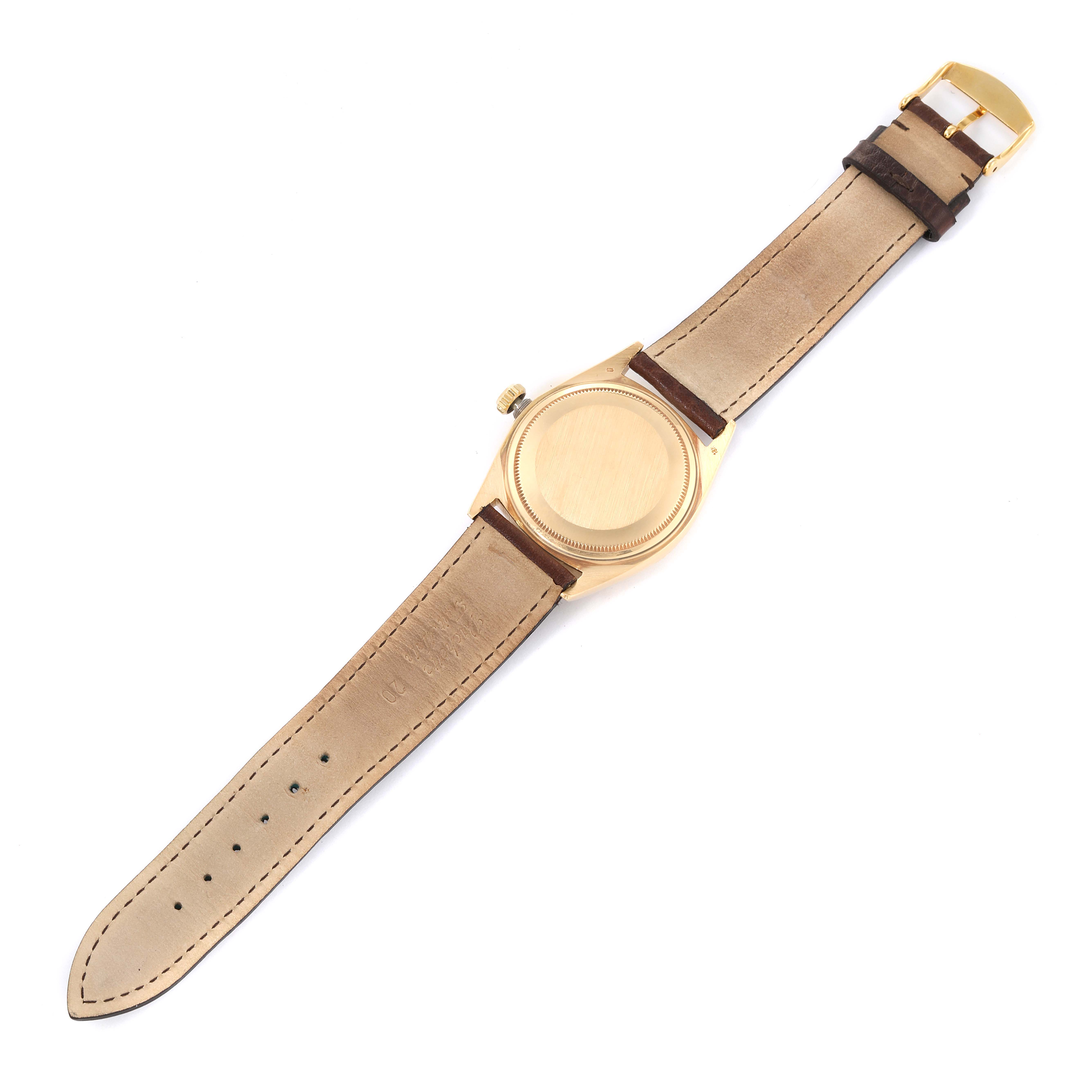 The image shows the back and strap of a Vintage Collection model by Rolex from a top-down angle.