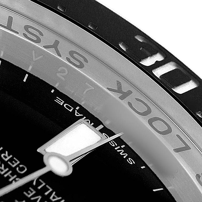 The image shows a close-up angle of the bezel and dial of the Rolex Sea-Dweller 116660 Men's Stainless Steel Black Dial, highlighting the "LOCK SYS" text and part of the minute hand.