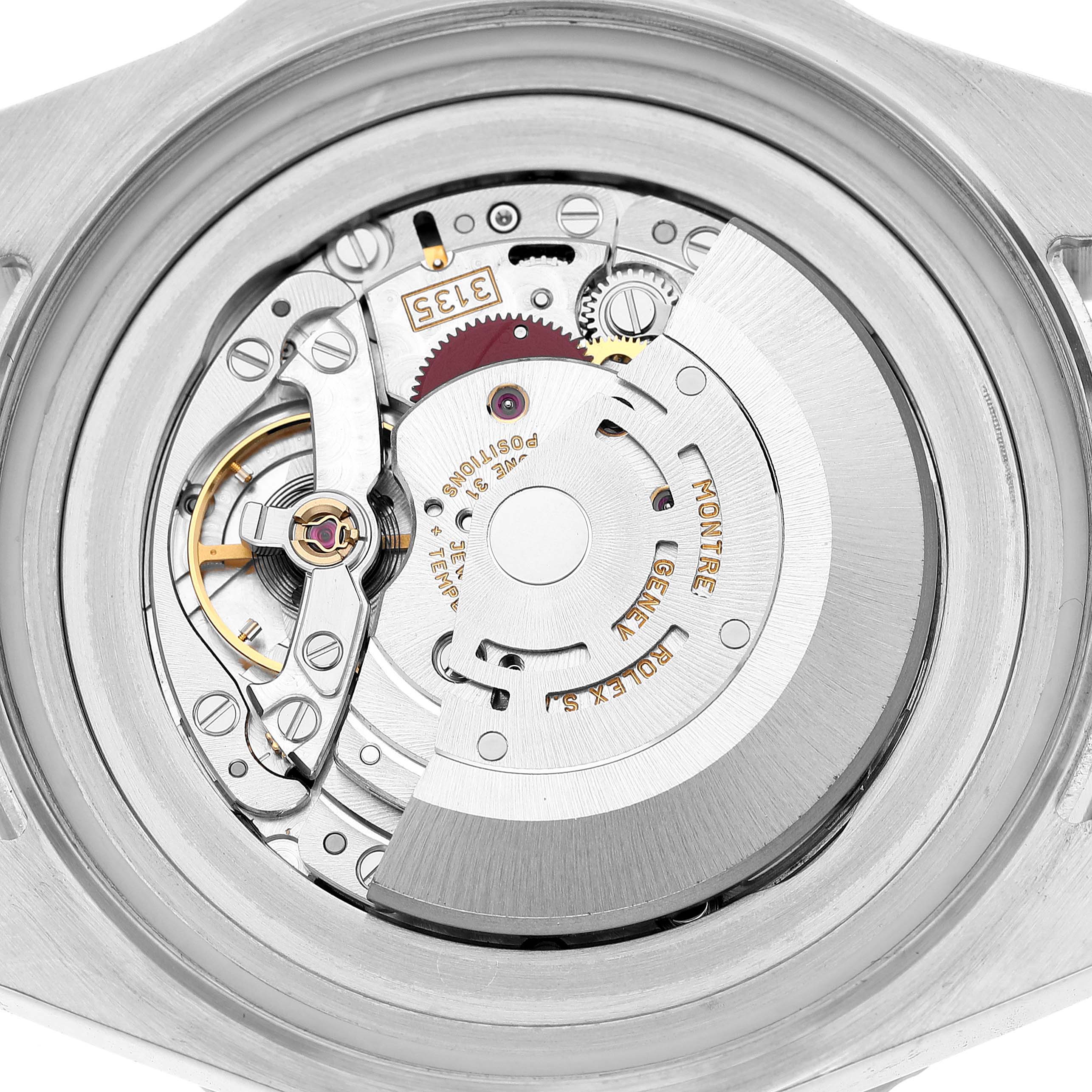 The image shows a close-up of the movement inside the Rolex Sea-Dweller 116660 Men's Stainless Steel Black Dial watch, highlighting gears and the rotor.