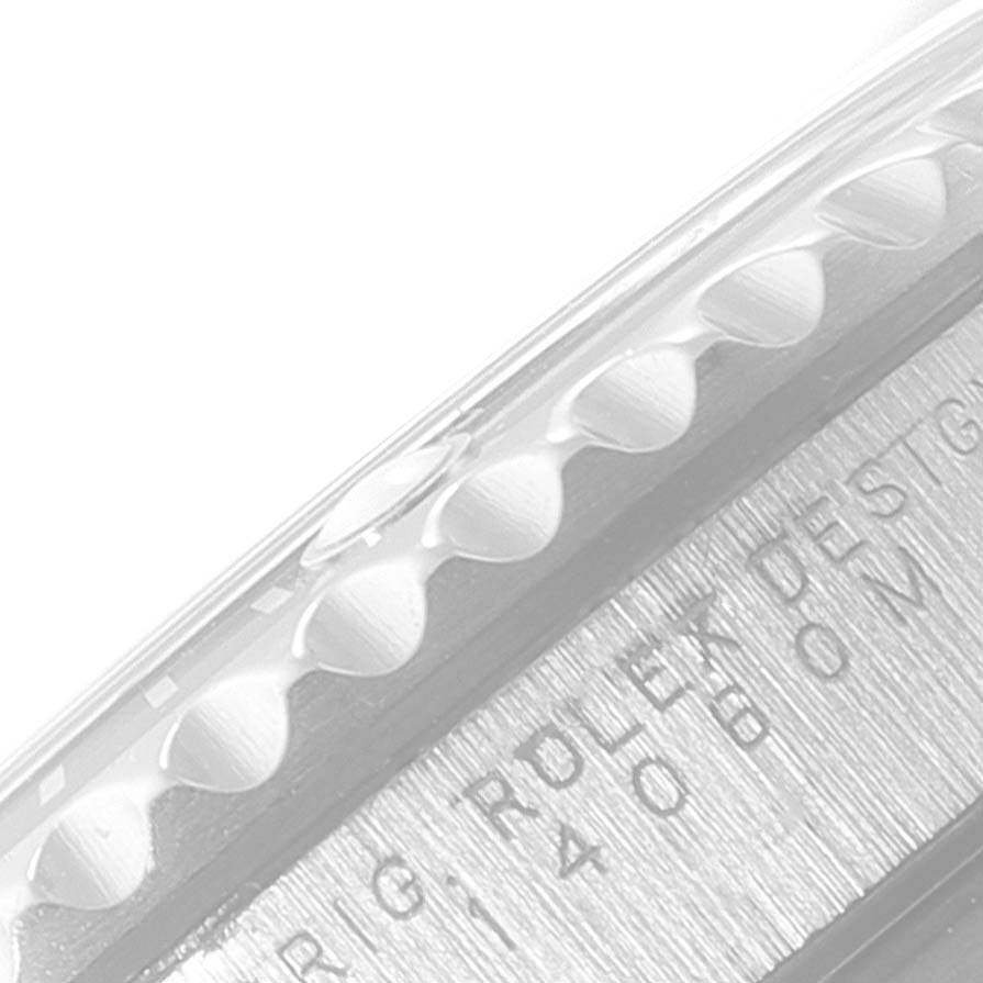 This close-up image shows the bezel
s edge and engraving on the side of a Rolex Submariner 14060 Men
s Stainless Steel Black Dial 14060 Men
s Stainless Steel Black Dial watch.