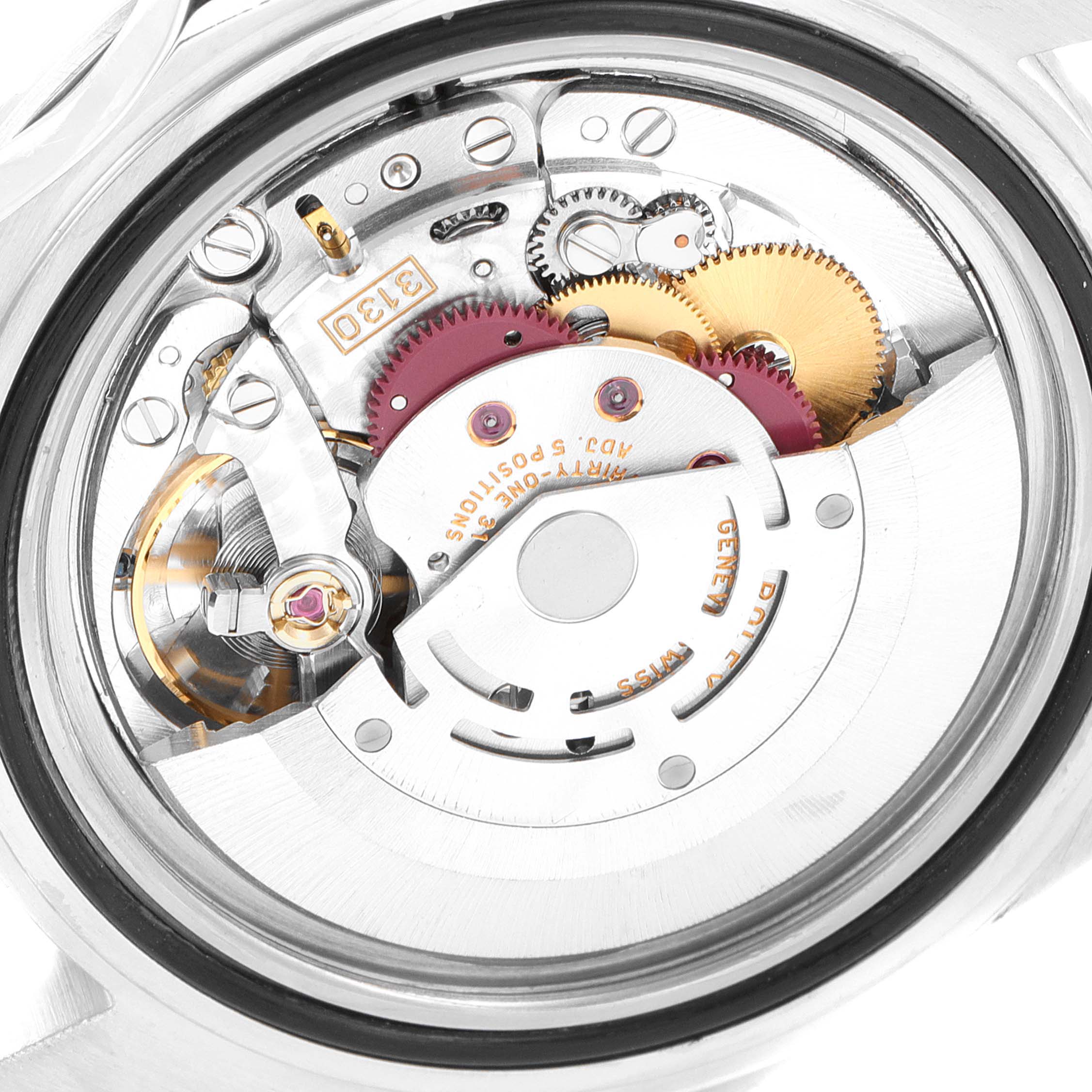 This image shows a close-up view of the internal movement of a Rolex Submariner 14060 Men
s Stainless Steel Black Dial 14060 Men
s Stainless Steel Black Dial watch, highlighting gears and mechanical components.