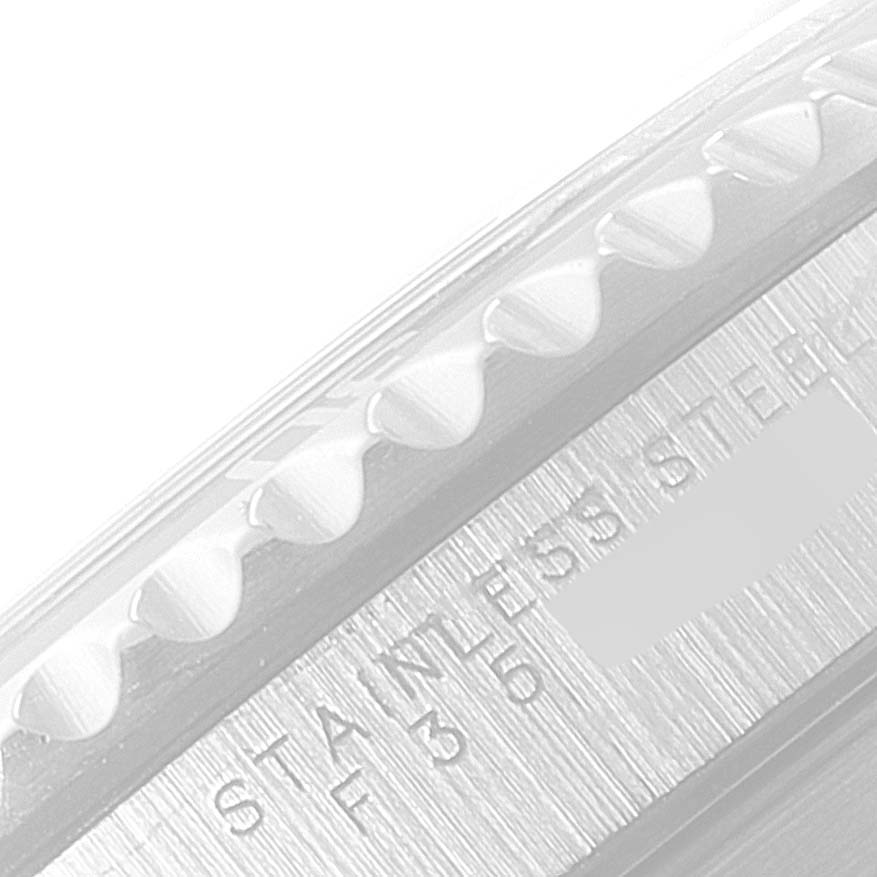 The image shows a close-up of a portion of the bezel and case of a Rolex Submariner 14060 Men
s Stainless Steel Black Dial 14060 Men
s Stainless Steel Black Dial, focusing on the text "STAINLESS STEEL."