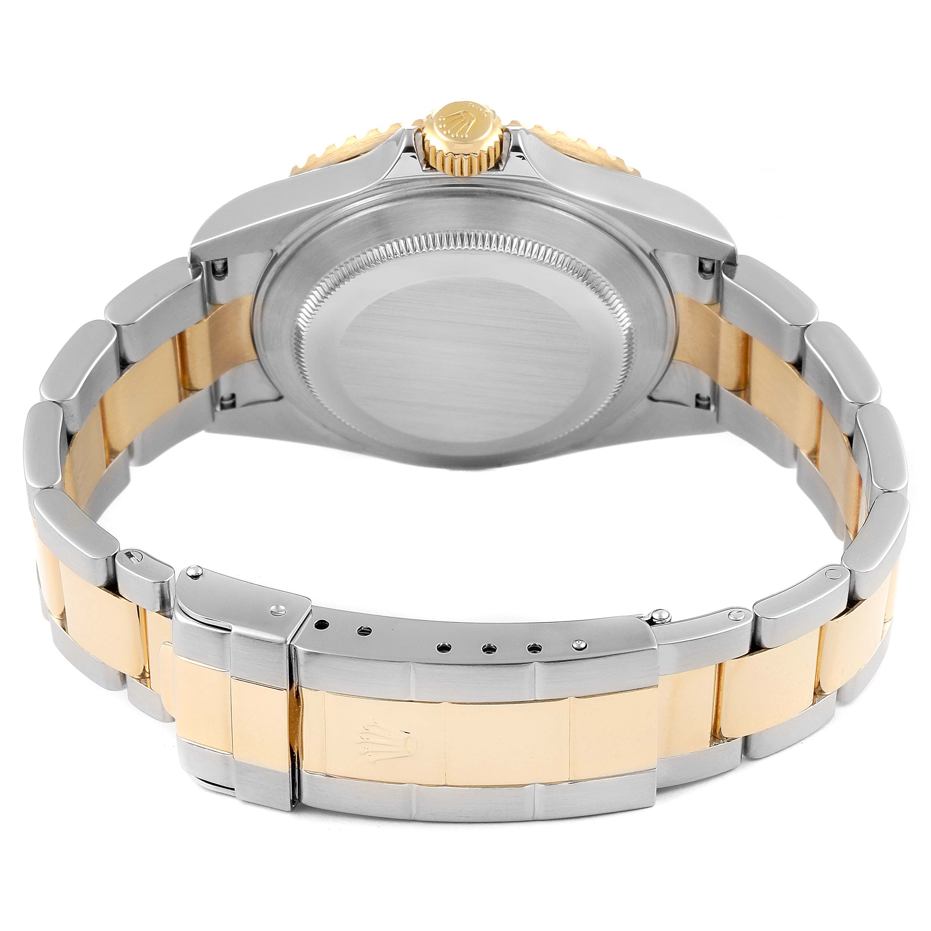 The image shows the back view of a Rolex Submariner 16613 Men's Steel and Gold (two tone) Black Dial 16613 Men's Steel and Gold (two tone) Black Dial, including the case back, crown, and two-tone bracelet.