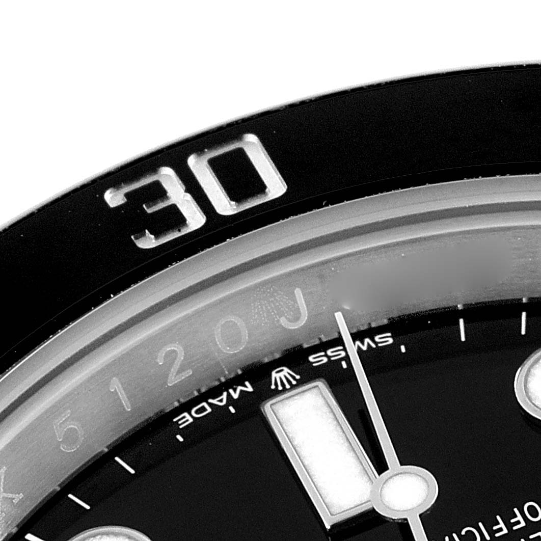 The image shows a close-up of the bezel, dial, and hour hand of a Rolex Submariner 126610 Men
s Stainless Steel Black Dial 126610 Men
s Stainless Steel Black Dial watch.