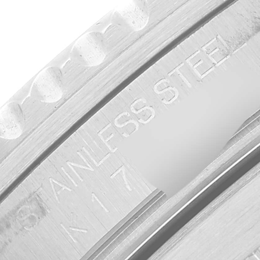 This close-up image shows the stainless steel bezel and part of the case of a Rolex Submariner 16610 Men's Stainless Steel Black Dial 16610 Men's Stainless Steel Black Dial watch.