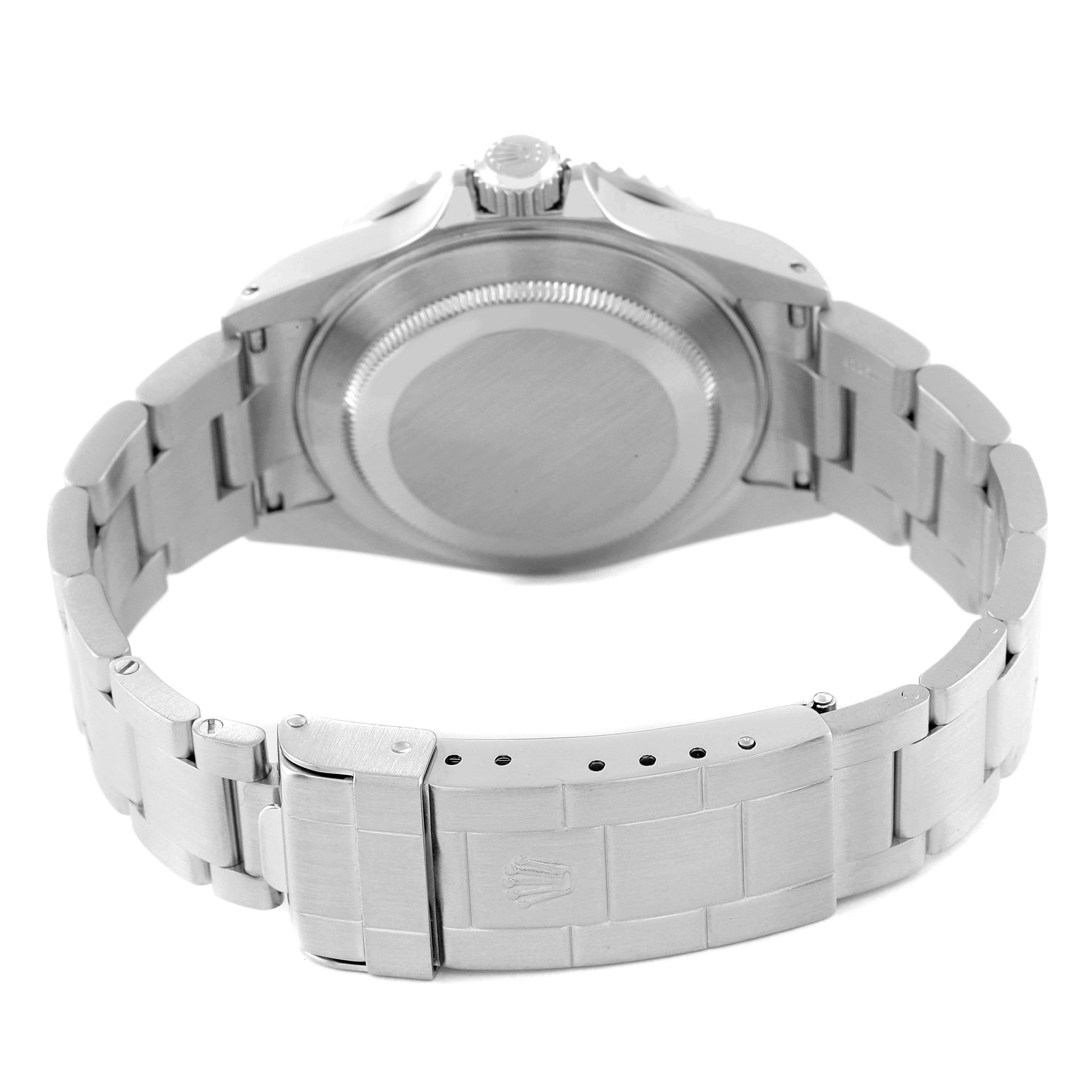 The image shows the back view of a Rolex Submariner 16610 Men's Stainless Steel Black Dial 16610 Men's Stainless Steel Black Dial, highlighting the case back and the clasp of the metal bracelet.