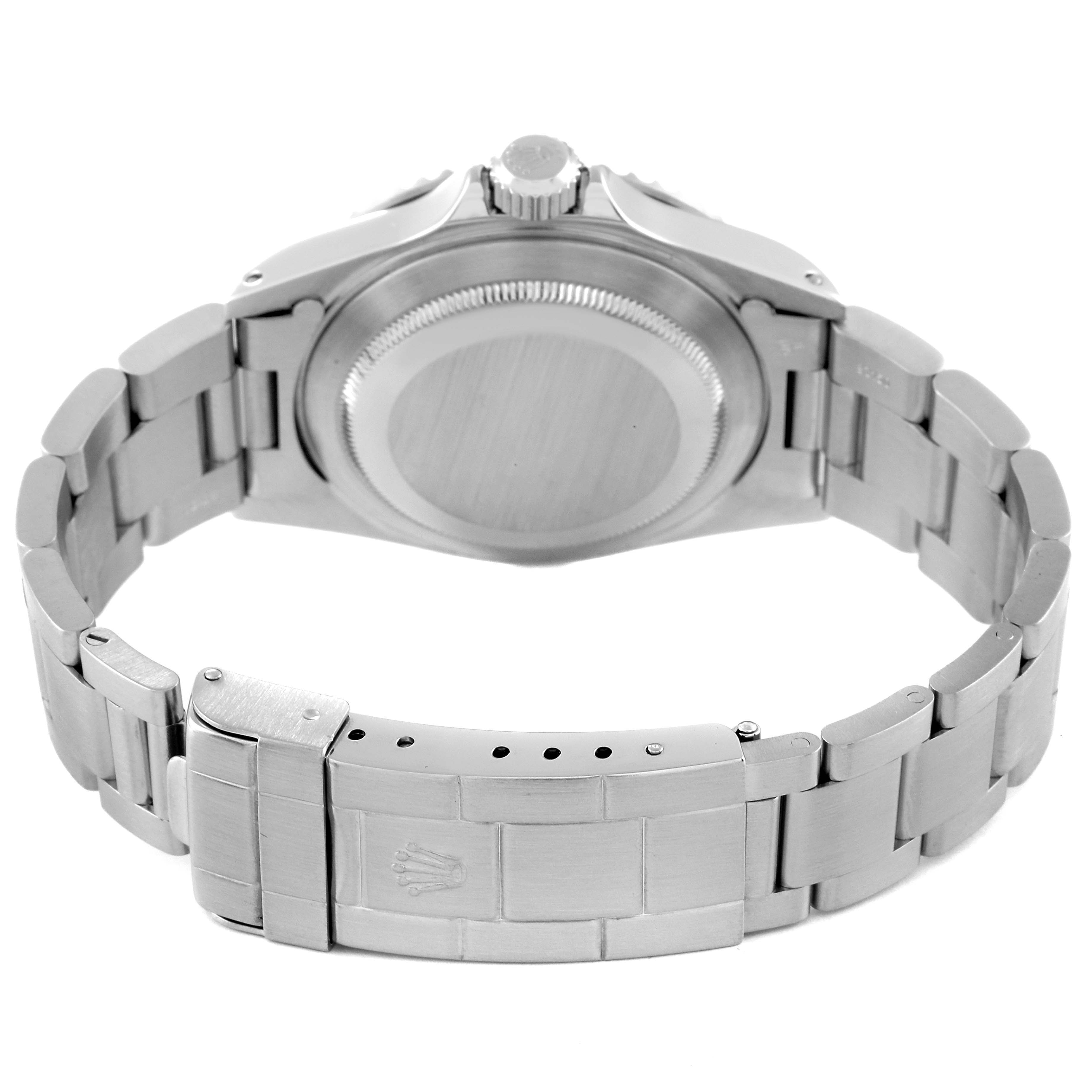 This image shows the back view of a Rolex Submariner 14060M Men
s Stainless Steel Black Dial 14060M Men
s Stainless Steel Black Dial watch, focusing on the case back and bracelet clasp.