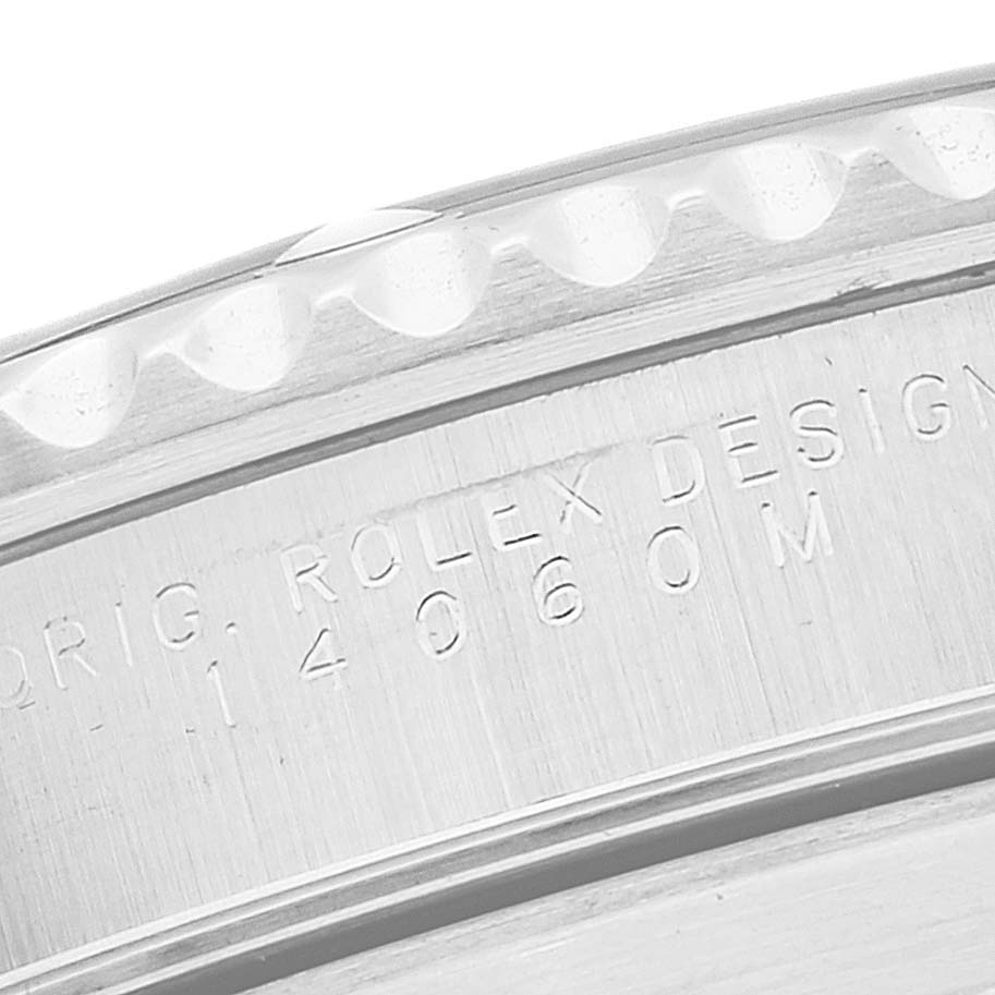 The close-up image shows the engraved side bezel and case of a Rolex Submariner 14060M Men
s Stainless Steel Black Dial 14060M Men
s Stainless Steel Black Dial watch.