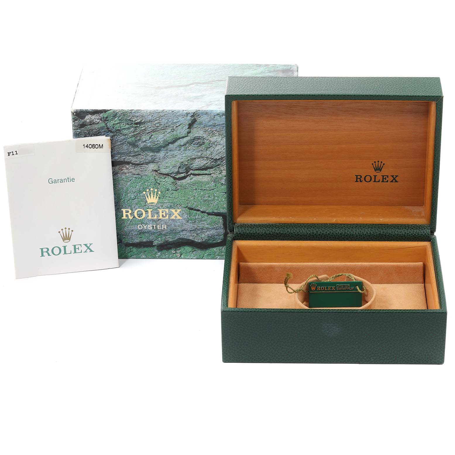 This image shows the packaging accessories for the Rolex Submariner 14060M Men
s Stainless Steel Black Dial 14060M Men
s Stainless Steel Black Dial, including the outer box, inner box, and warranty booklet.