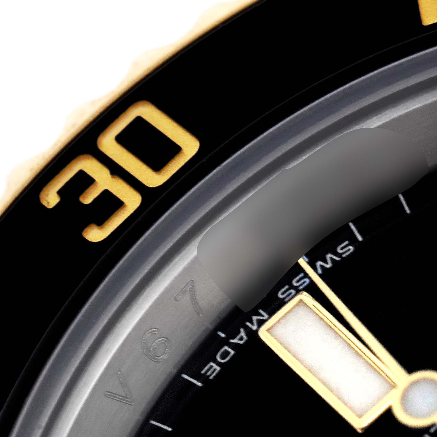 The image shows a close-up of the bezel, part of the dial, and the minute hand of a Rolex Submariner 116613 Men's Steel and Gold (two tone) Black Dial 116613 Men's Steel and Gold (two tone) Black Dial watch.