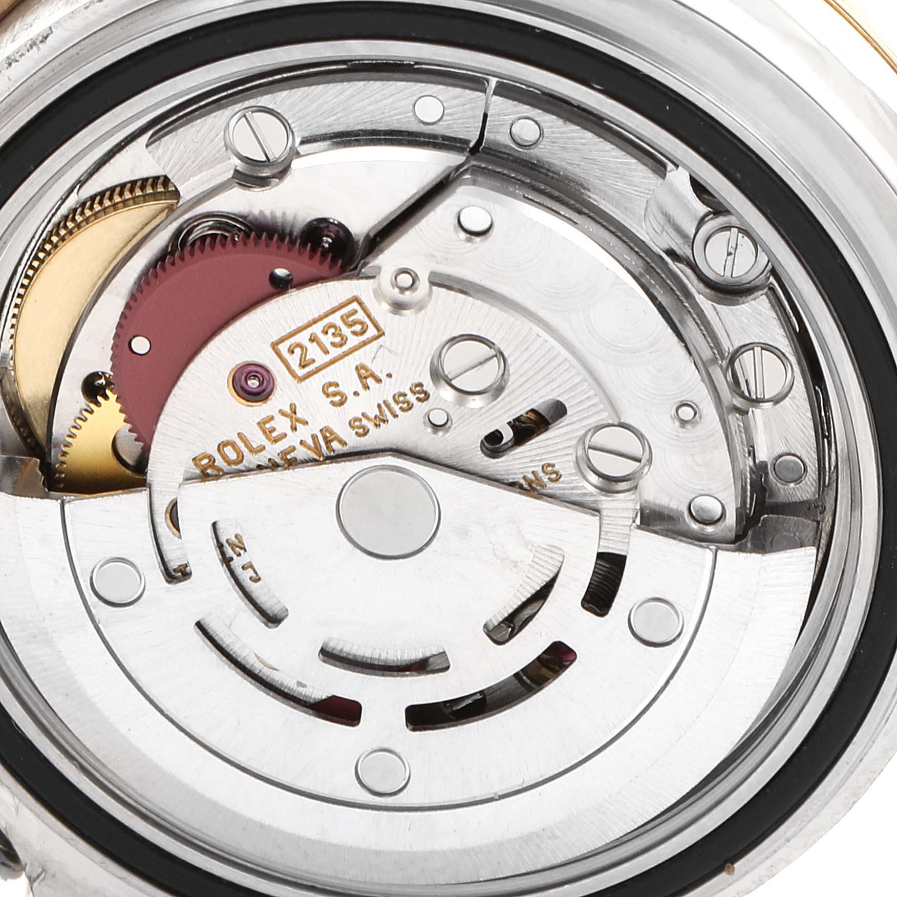 The image shows a close-up view of the intricate movement mechanism of a Rolex Yacht-Master 69623 Women's Steel and Gold (two tone) White Dial 69623 Women's Steel and Gold (two tone) White Dial watch.