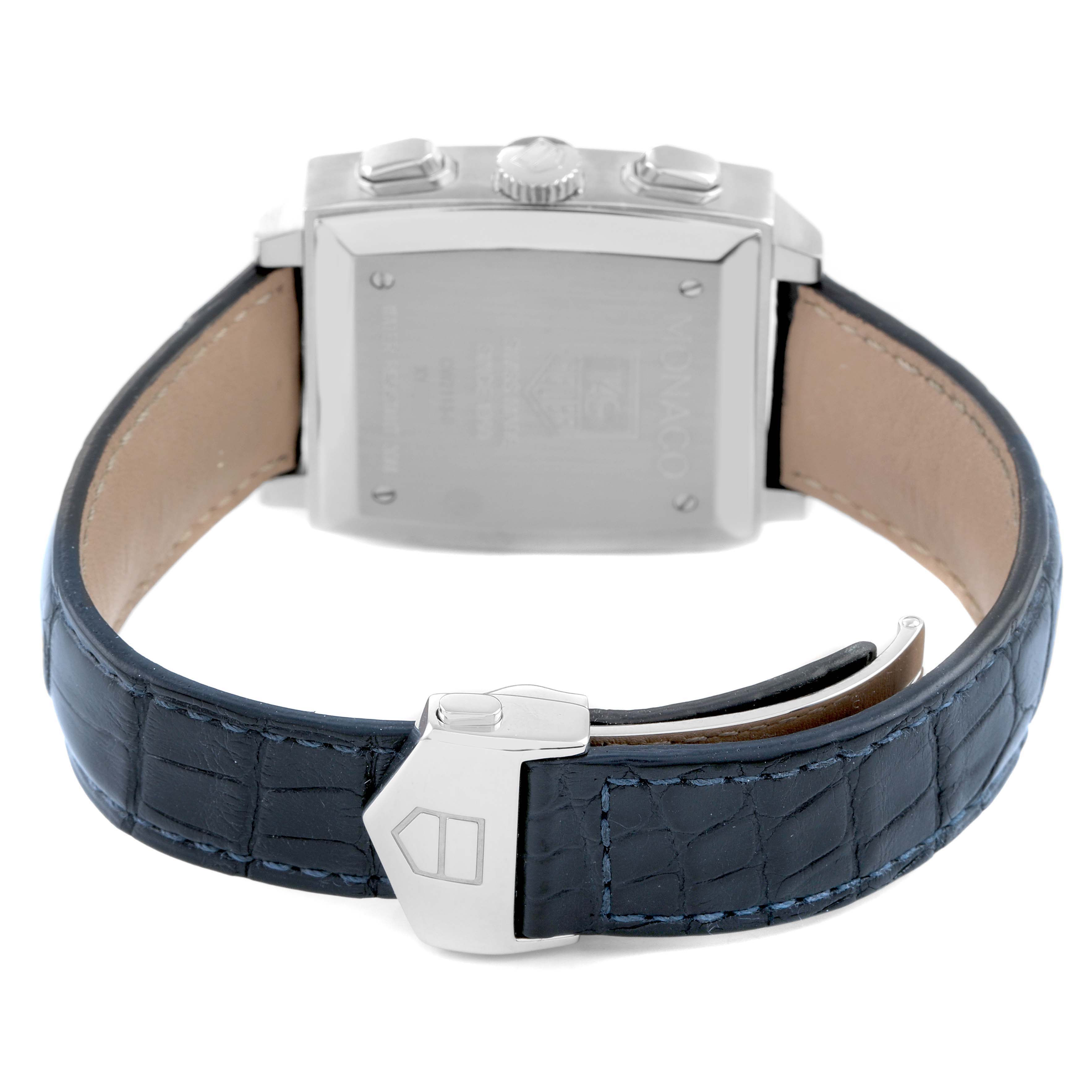 The image shows the back view of the Tag Heuer Monaco CW2113 Men's Stainless Steel Blue Dial watch, highlighting its clasp, strap, and case back.