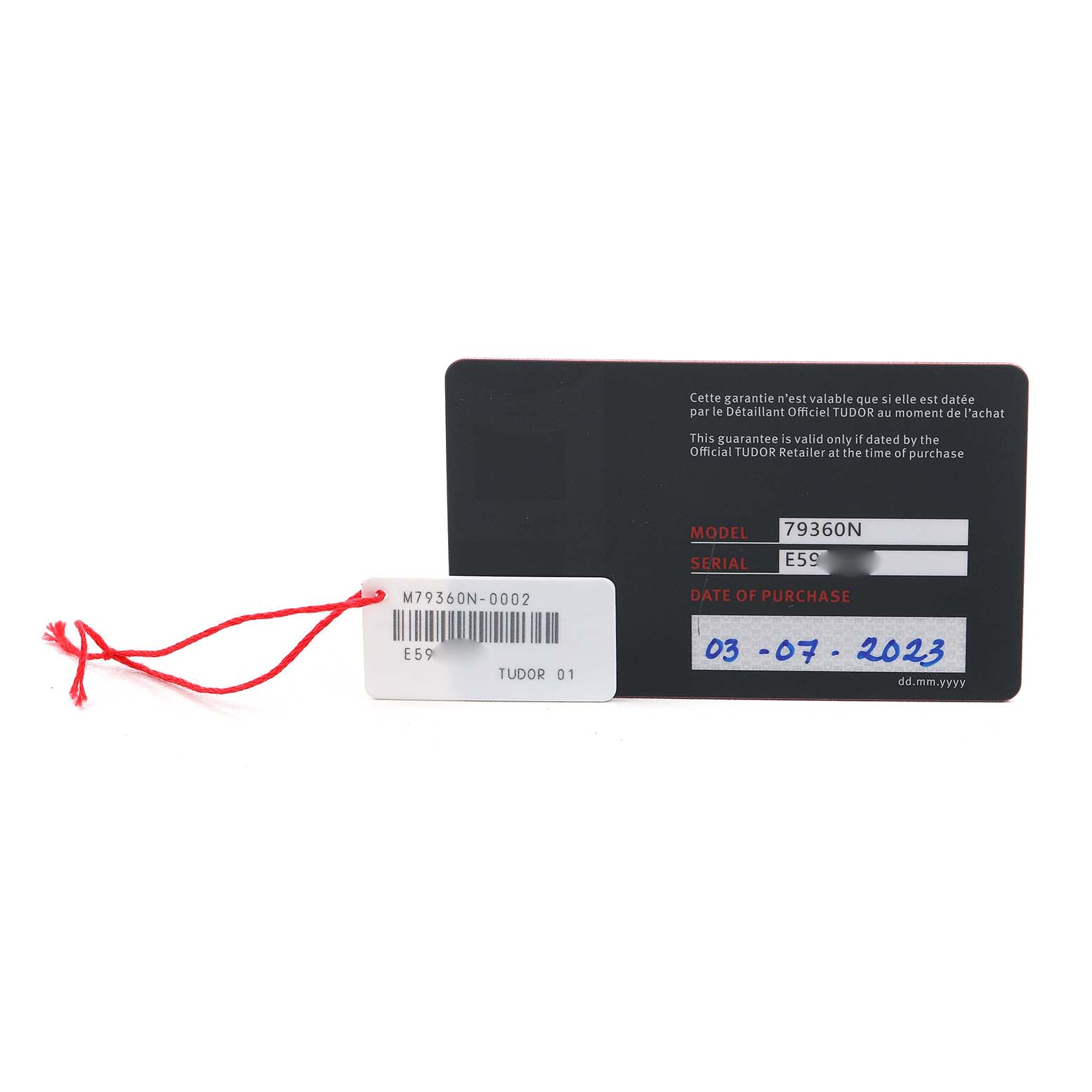 The image shows the warranty card of a Tudor Heritage Black Bay 79360 Men's Stainless Steel Silver Dial watch, featuring model and serial numbers, along with a red string tag.