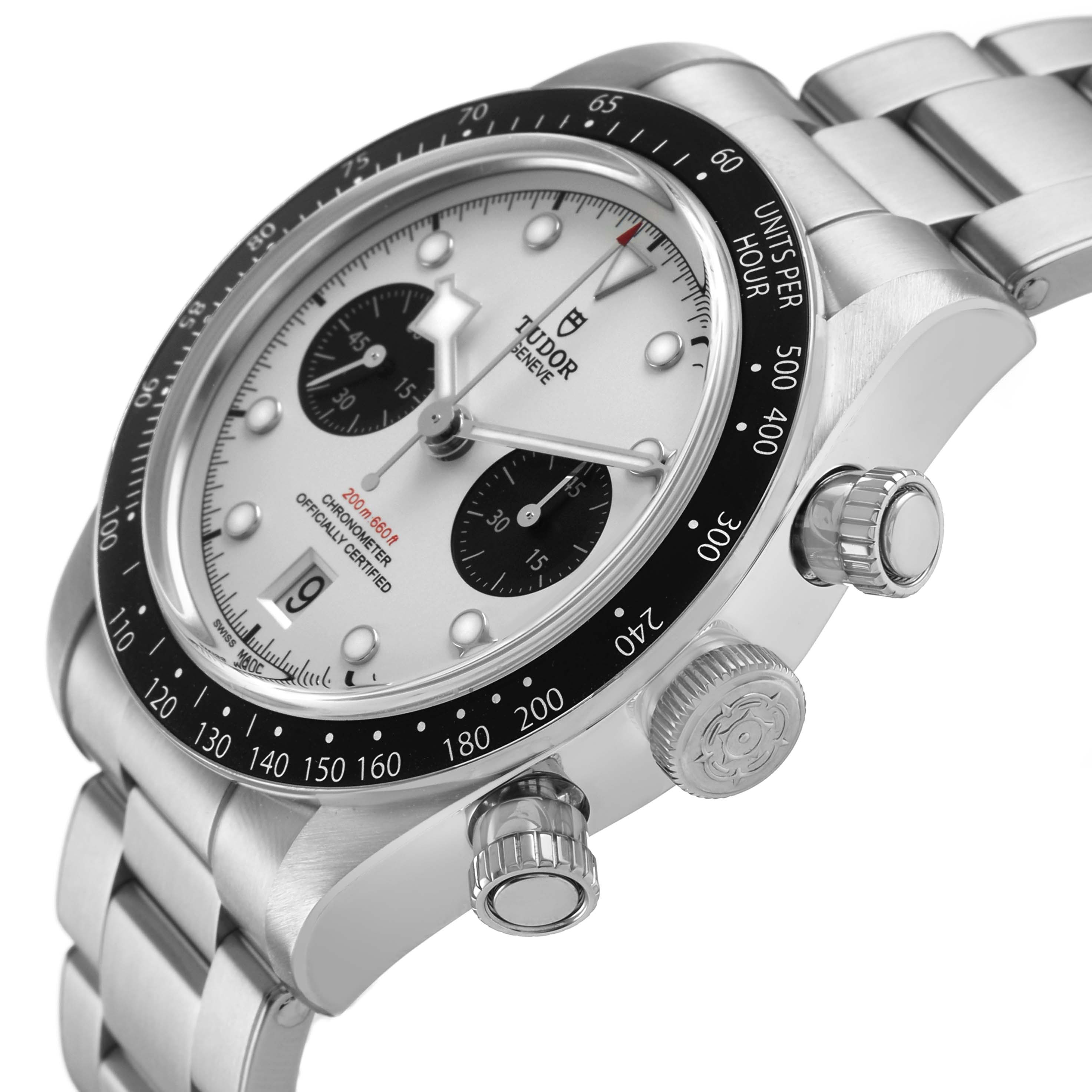 The Tudor Heritage Black Bay 79360 Men's Stainless Steel Silver Dial watch is shown from a side angle, highlighting the case, bezel, dial, crown, and bracelet.