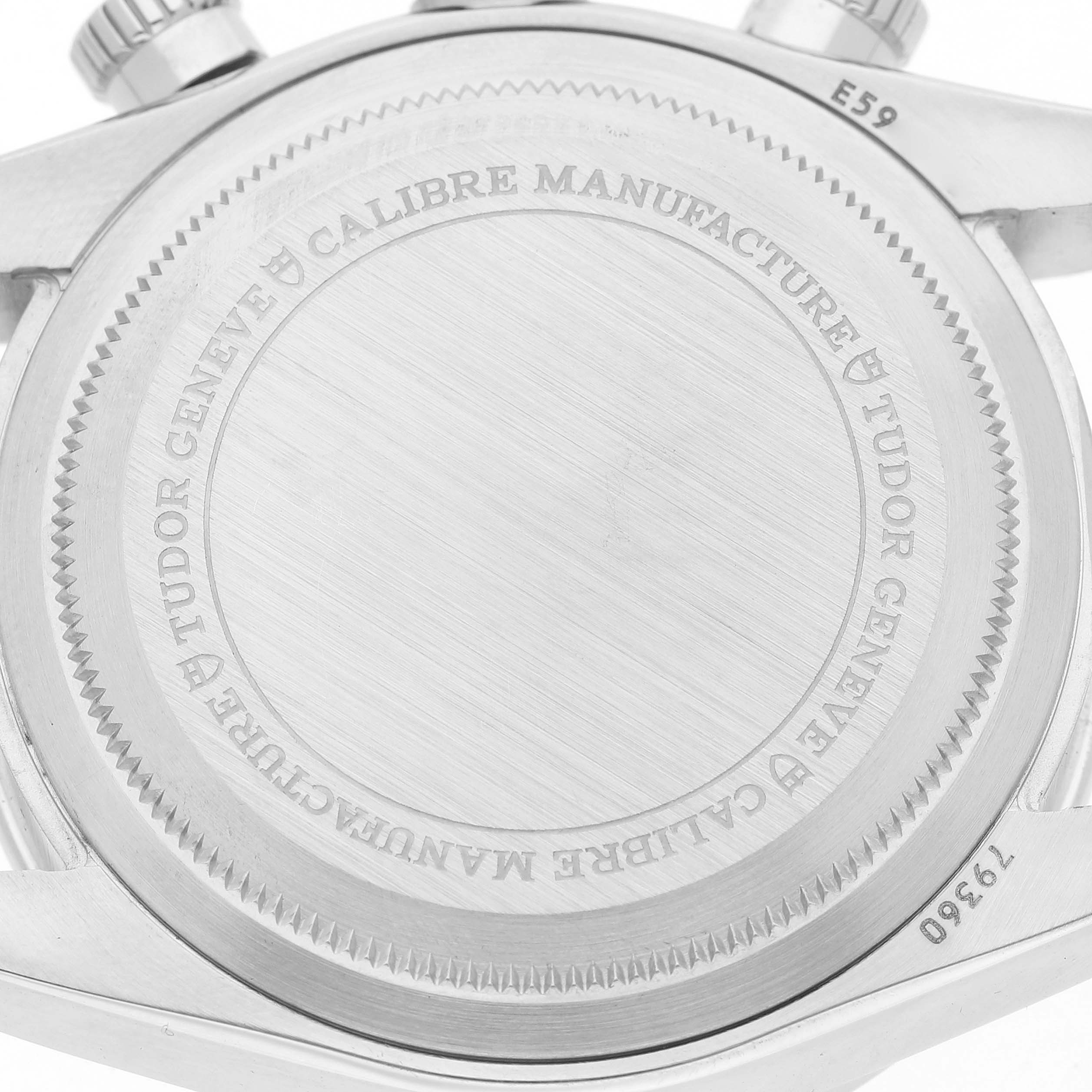 The image shows the case back of a Tudor Heritage Black Bay 79360 Men's Stainless Steel Silver Dial watch, highlighting engraved details and the crown.