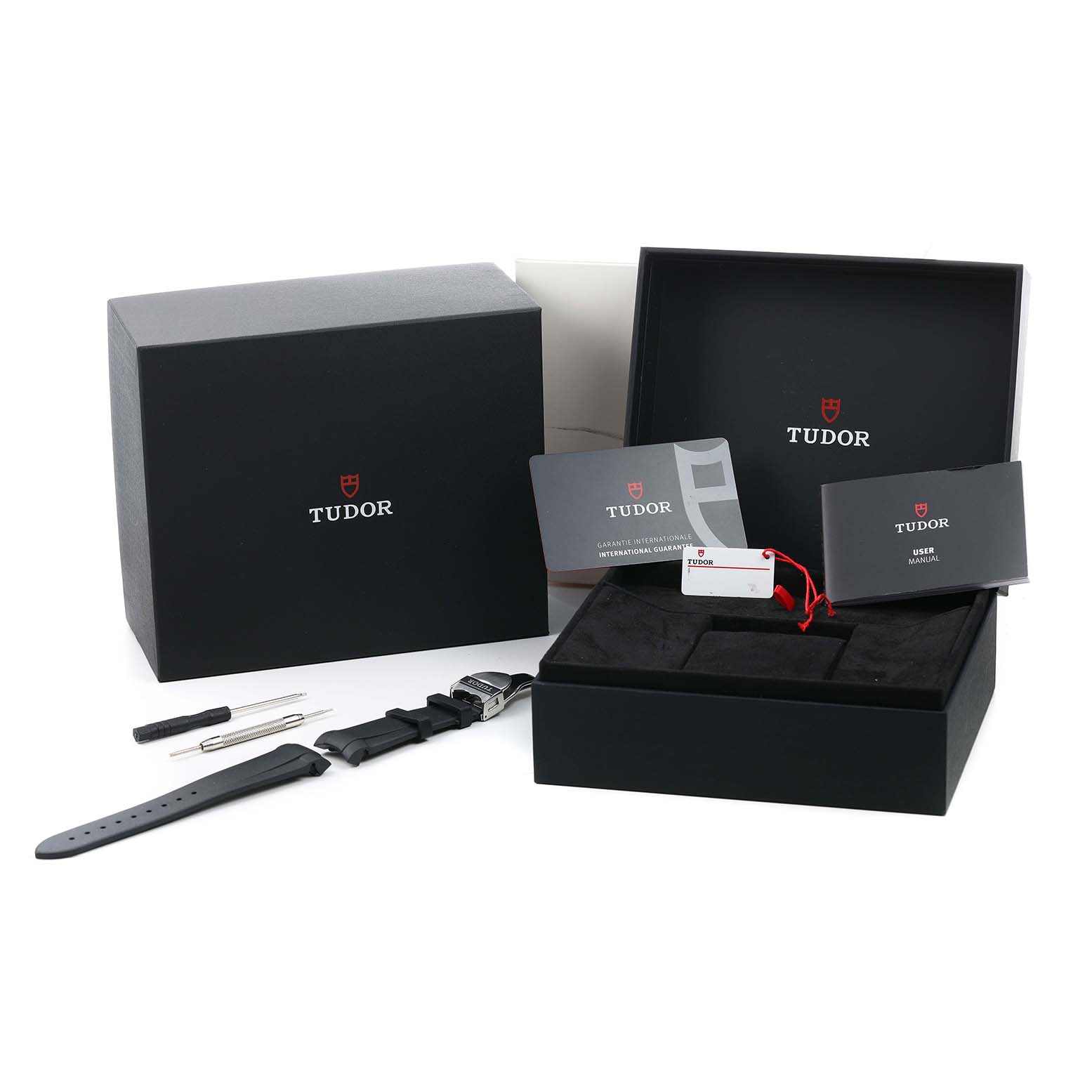 The image shows Tudor Heritage Black Bay 79360 Men's Stainless Steel Silver Dial packaging with a box, extra strap, tools, and warranty cards, viewed from the front.