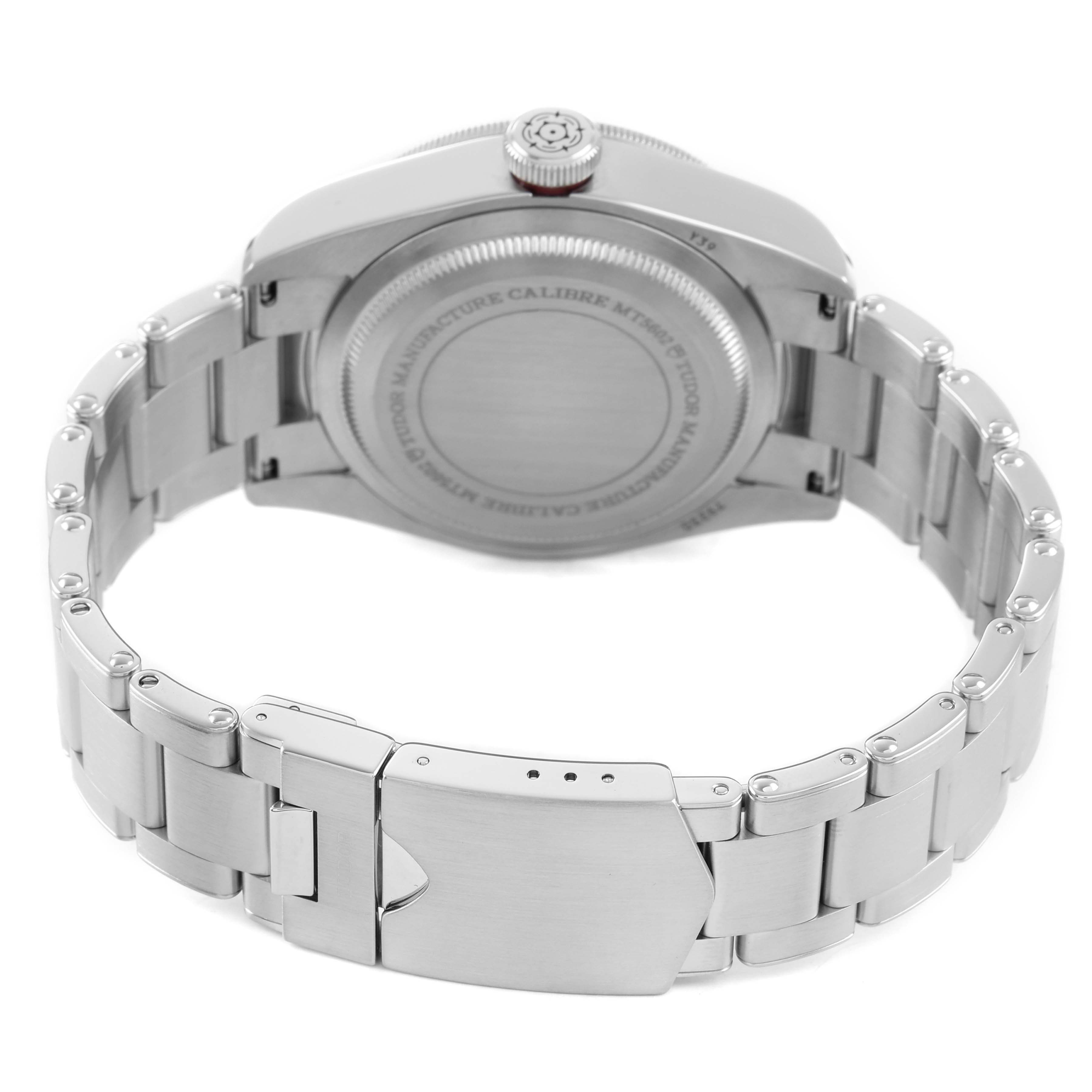 The image shows the Tudor Heritage Black Bay 79230R Men's Stainless Steel Black Dial watch from the back, highlighting the case back and bracelet clasp.