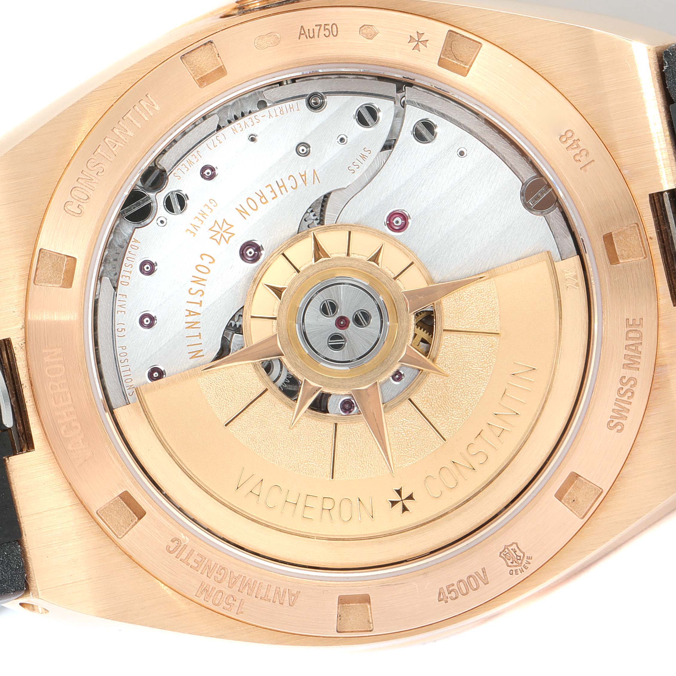 The image shows the back of a Vacheron Constantin Overseas 4500V/000R-B127 Men's Rose Gold Silver Dial 4500V/000R-B127 Men's Rose Gold Silver Dial watch, highlighting the automatic movement and the rotor.