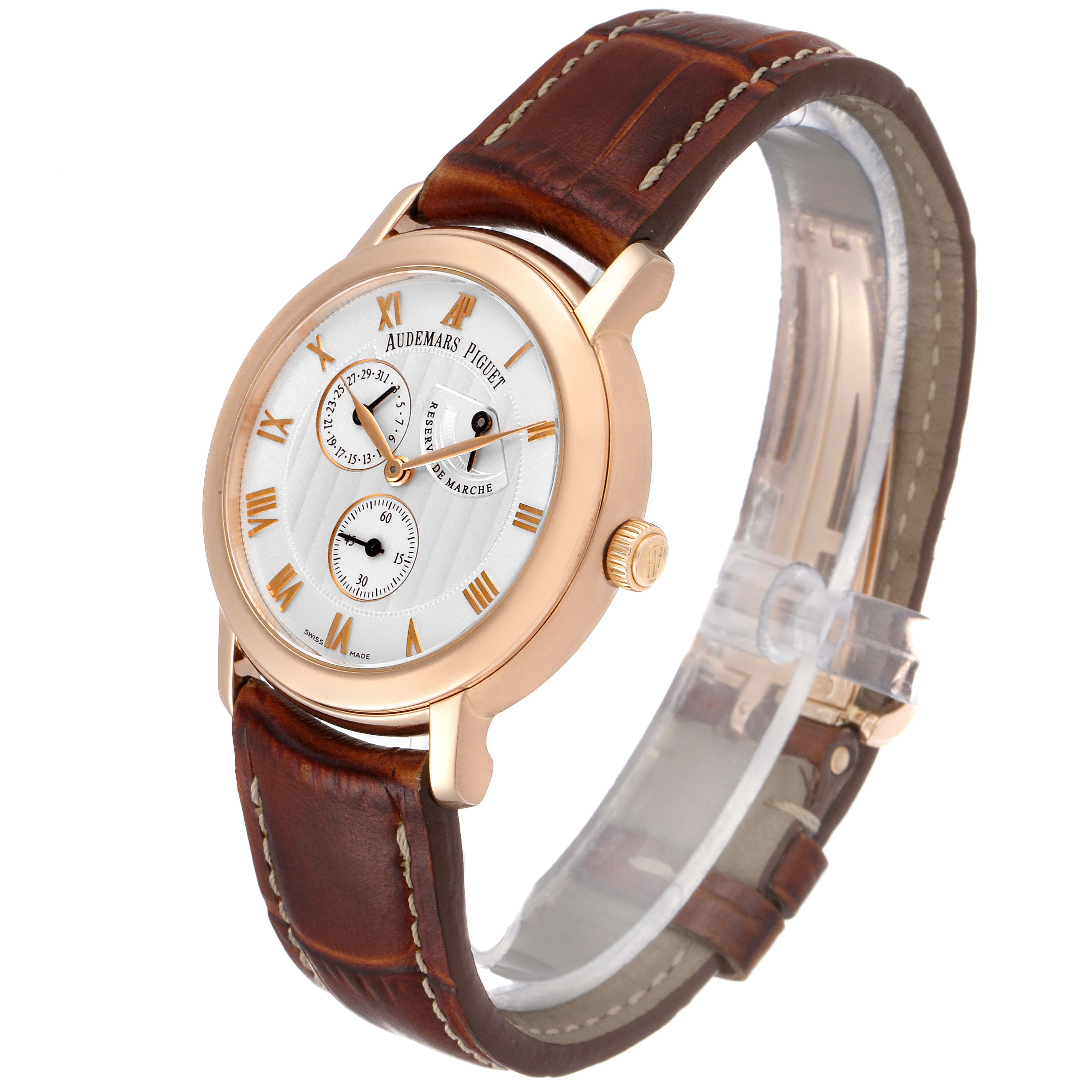 The Jules model by Audemars Piguet is shown at an angle displaying the face, crown, and brown leather strap.