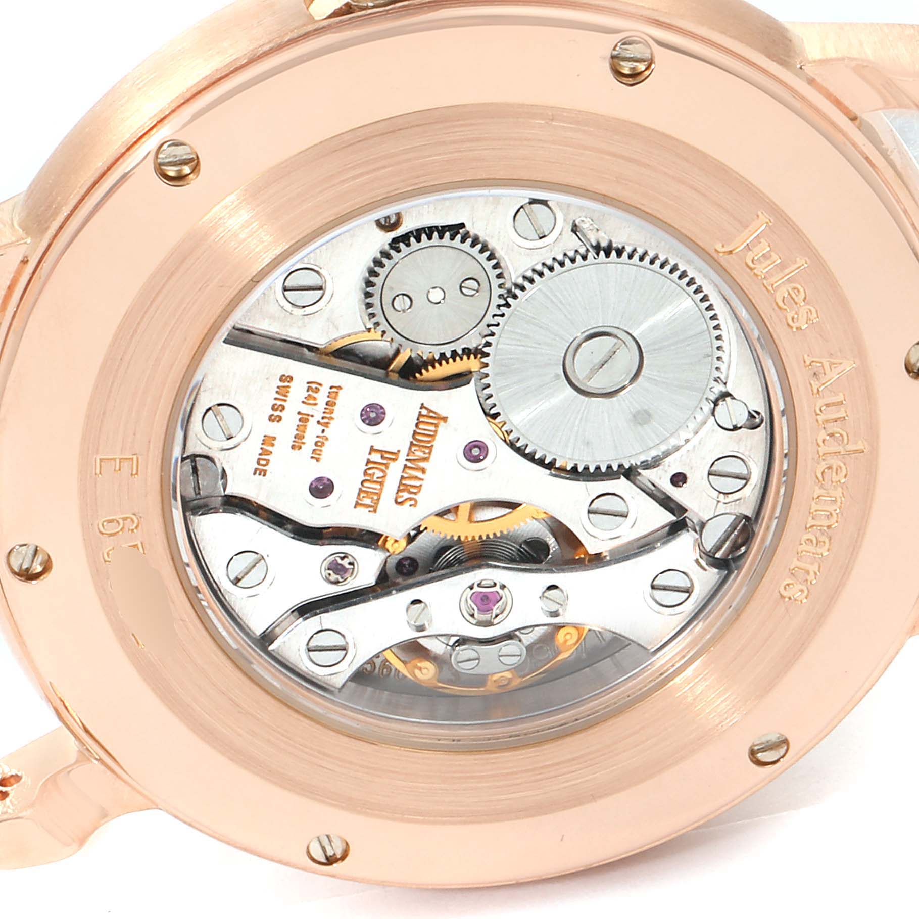 The image shows the back angle of the Jules model by Audemars Piguet, displaying its intricate mechanical movement.