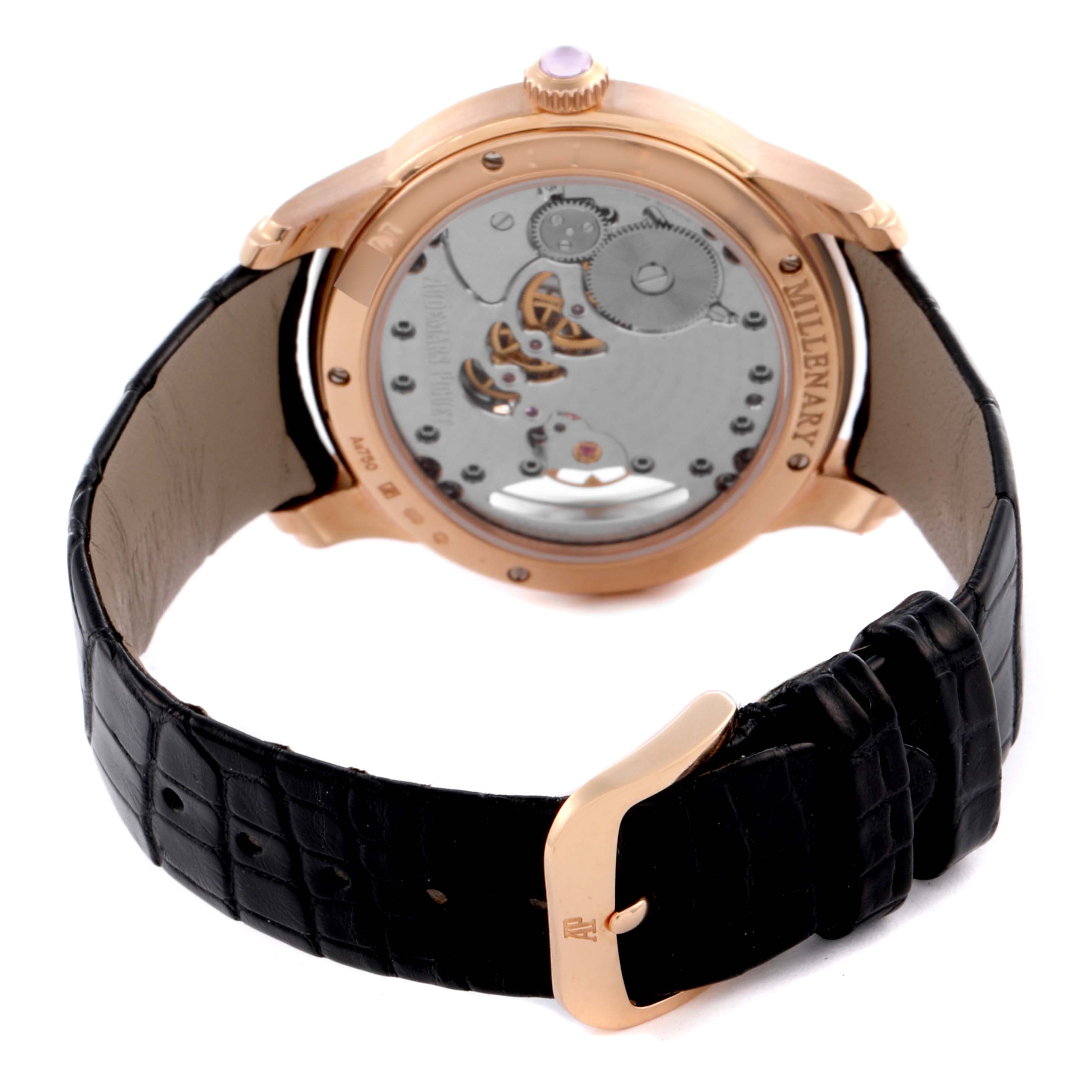 The Audemars Piguet Millenary 77247OR Women's Rose Gold Mother of Pearl Dial 77247OR Women's Rose Gold Mother of Pearl Dial watch is shown from the back, highlighting the movement, rose gold case, and black leather strap with a clasp.