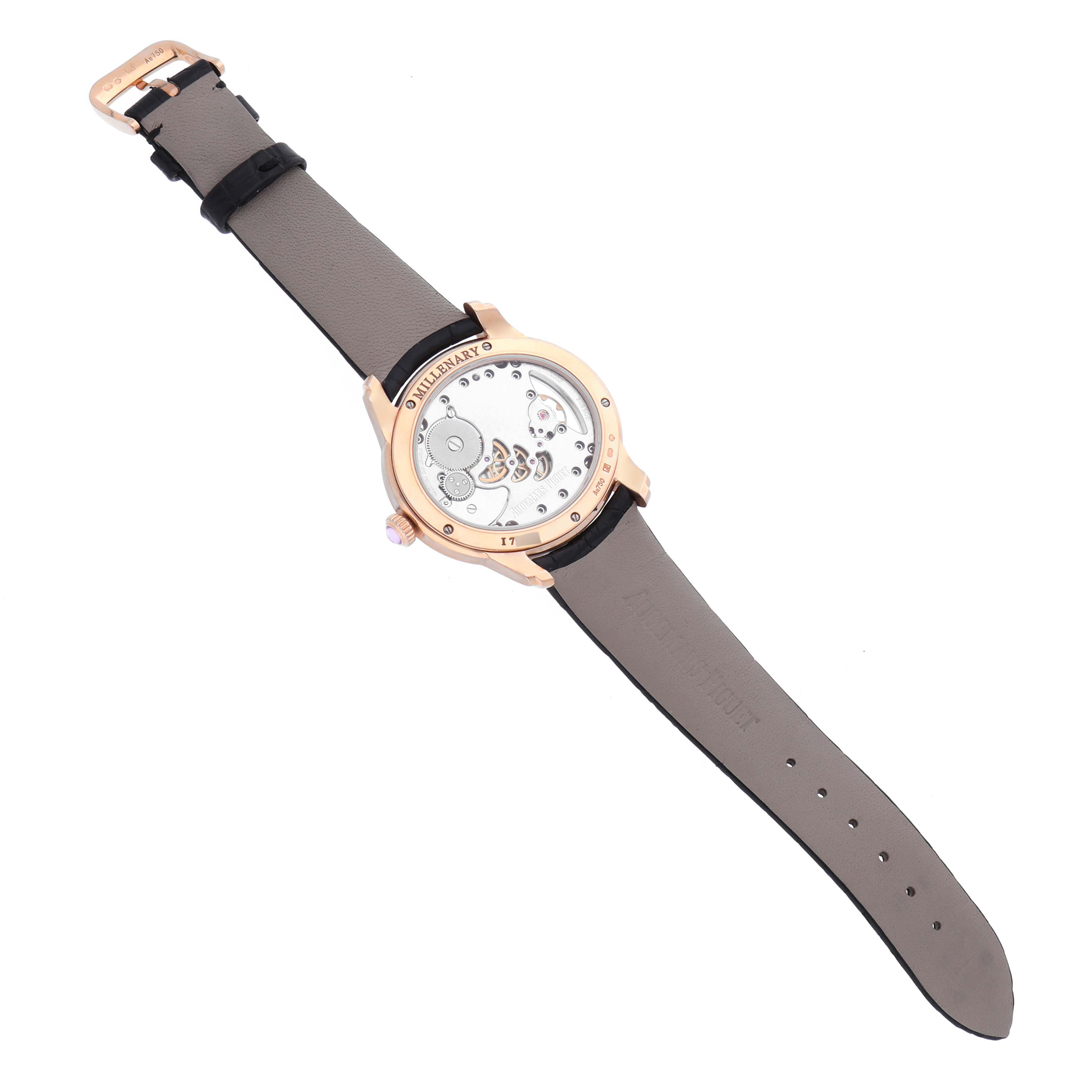 The Audemars Piguet Millenary 77247OR Women's Rose Gold Mother of Pearl Dial 77247OR Women's Rose Gold Mother of Pearl Dial watch is shown from the back, highlighting the exposed movement and leather strap.