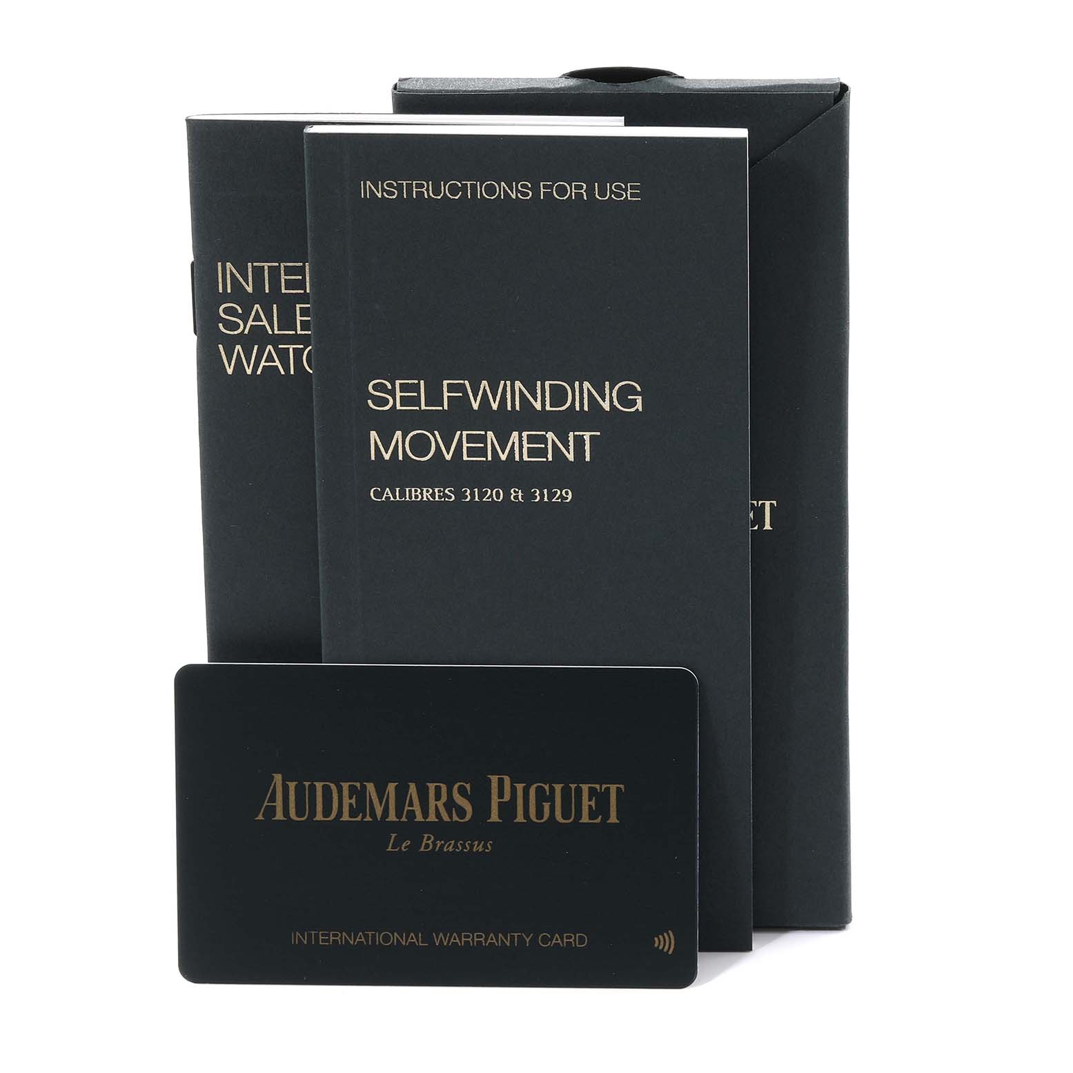 The image shows manuals and an international warranty card for the Audemars Piguet Royal Oak 15450ST Men's Stainless Steel Grey Dial 15450ST Men's Stainless Steel Grey Dial model.