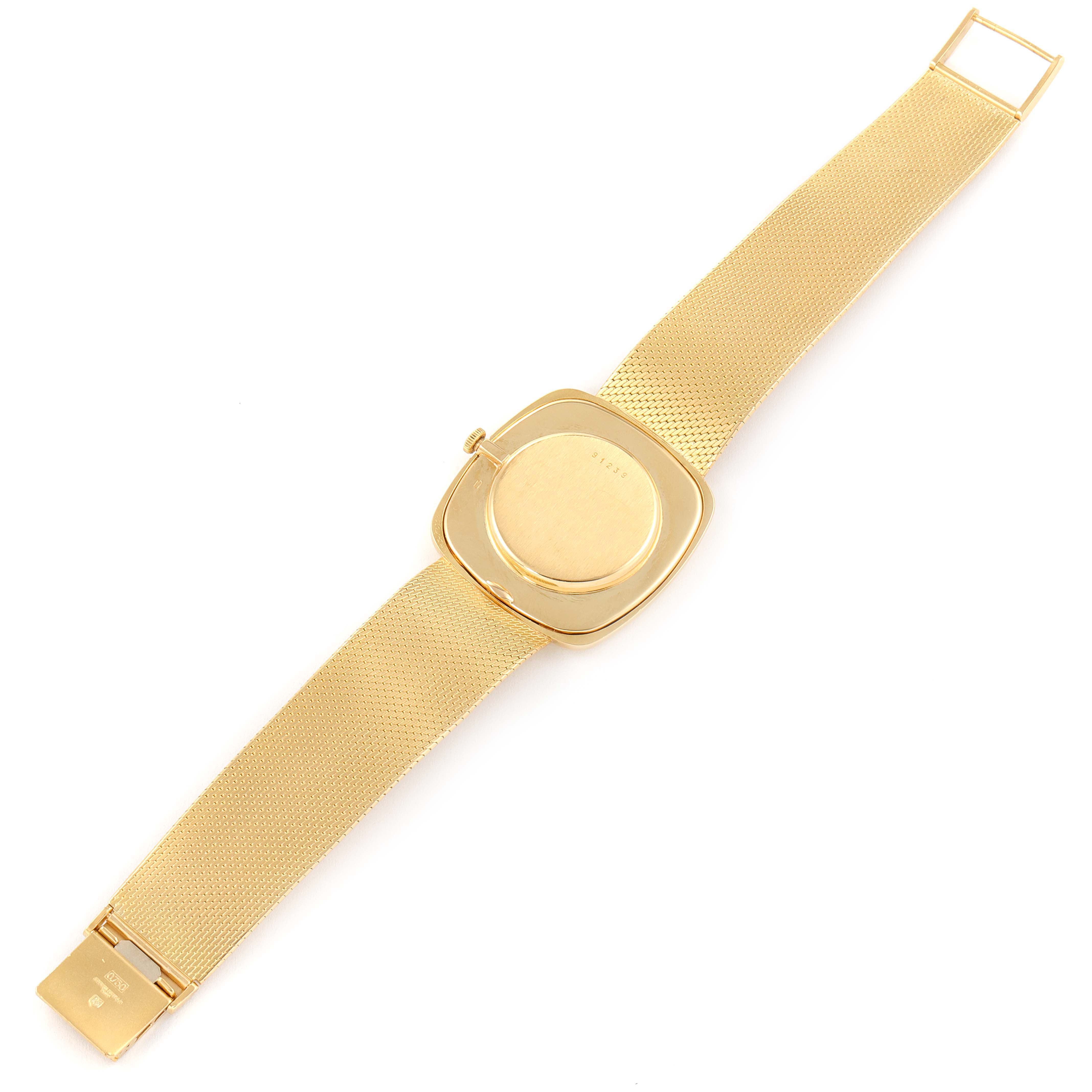 This image shows the back view of a Vintage Audemars Piguet watch, showcasing its gold case, strap, and clasp.