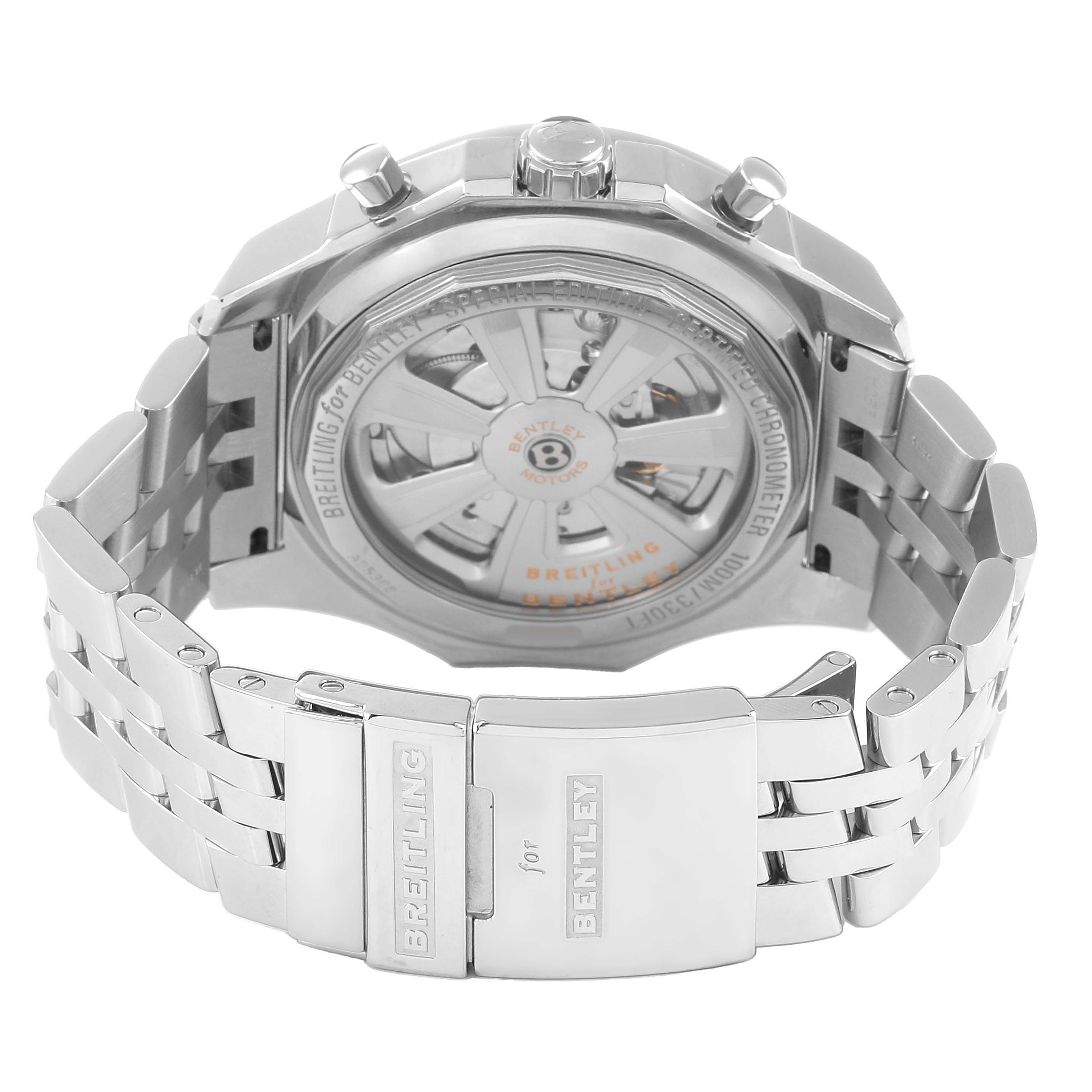The Breitling Bentley A25366 Men's Stainless Steel Silver Dial watch is shown from the back, highlighting the exhibition case back and metal bracelet with branding.