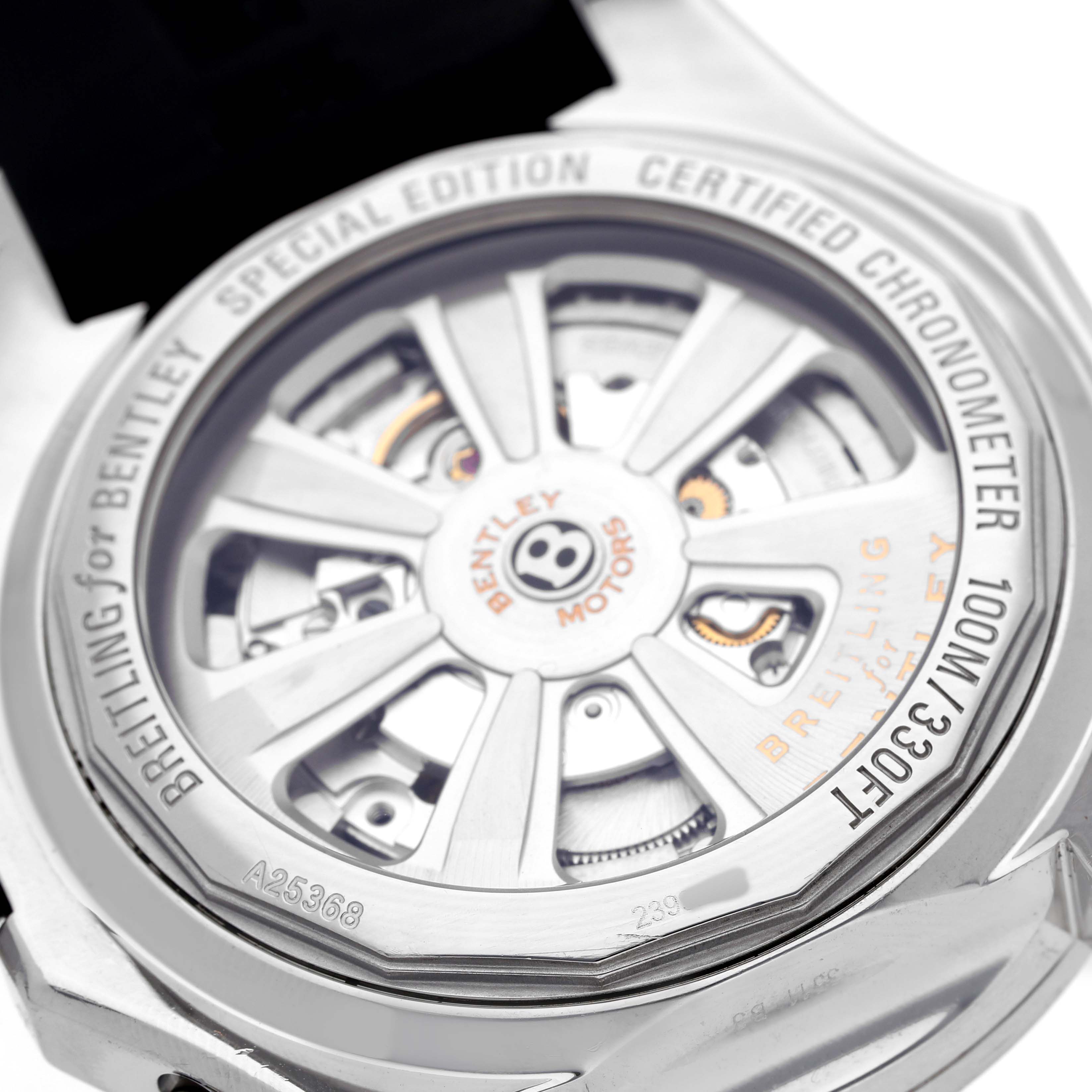 The Breitling for Bentley watch is shown from the back, highlighting the rotor and internal movement details.