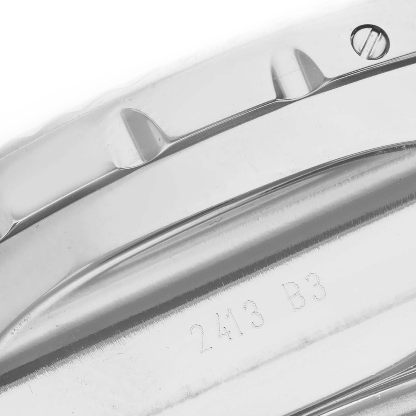 This image shows a close-up of the stainless steel case edge with engraved numbers on the Bentley model by Breitling.