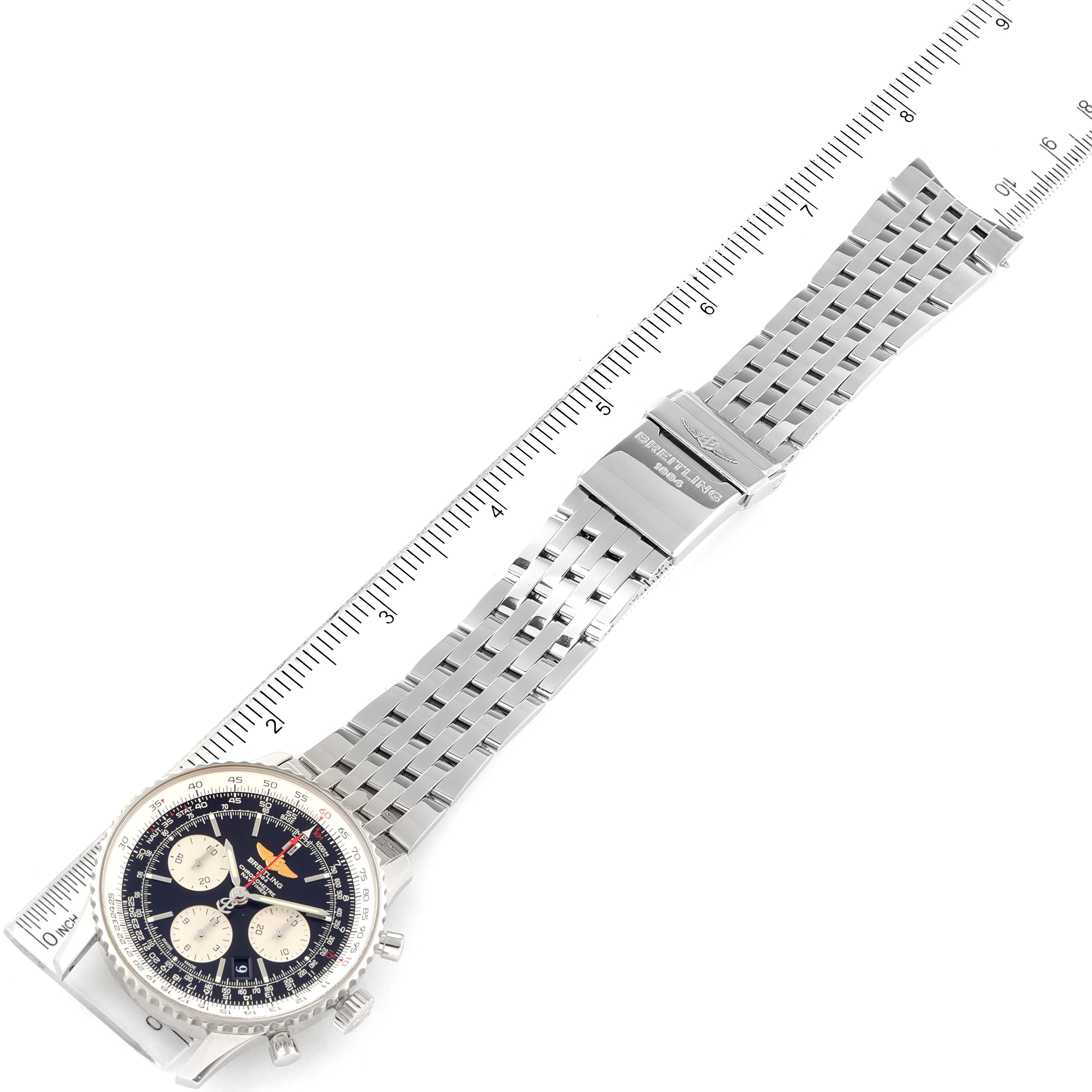 The angle shows the entire Breitling Navitimer AB0120 Men's Stainless Steel Black Dial AB0120 Men's Stainless Steel Black Dial watch and its stainless steel bracelet laid flat beside a ruler for measurement.