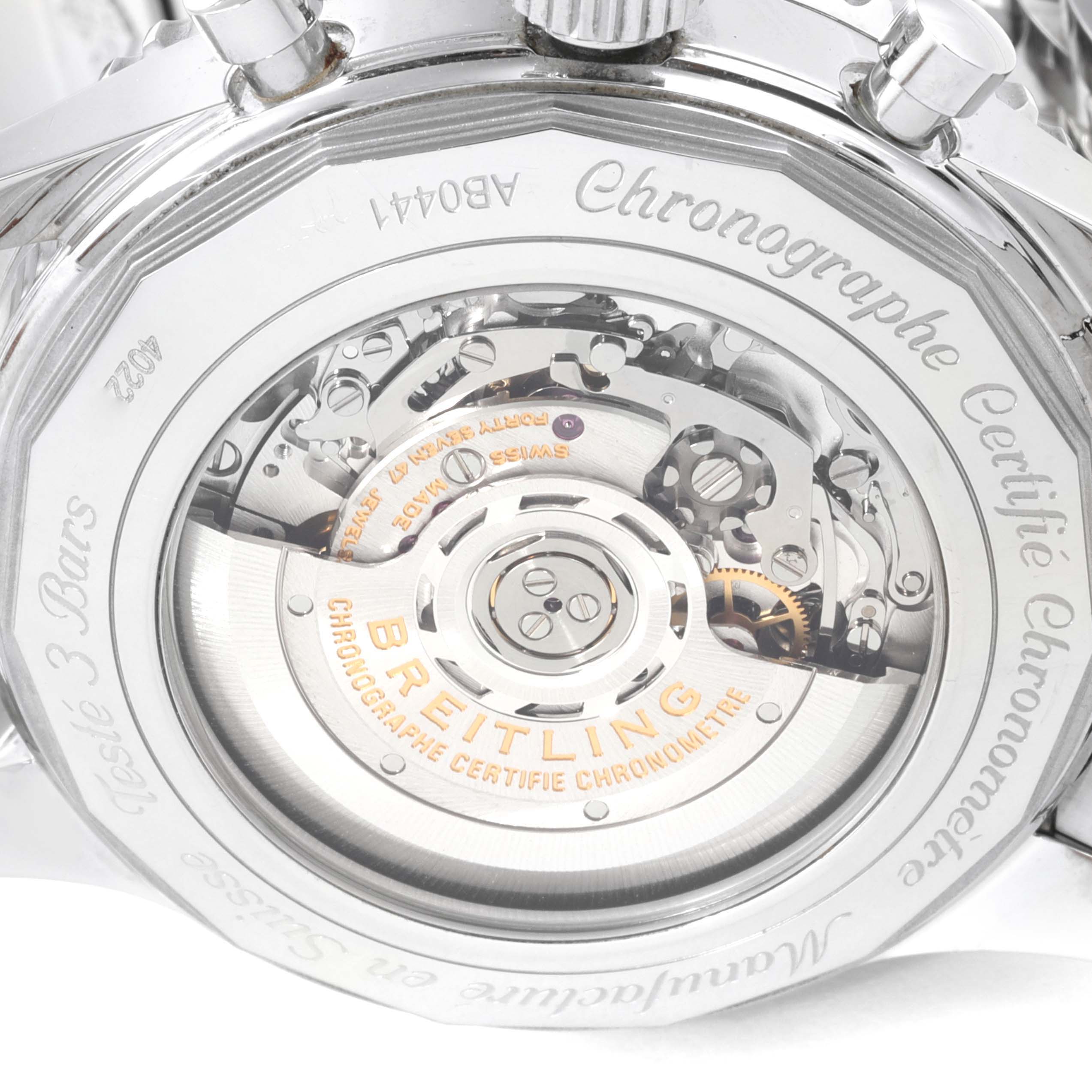 The image shows the back case of the Breitling Navitimer AB044121/BD24/443A Men's Stainless Steel Black Dial AB044121/BD24/443A Men's Stainless Steel Black Dial watch, displaying its movement and engravings.