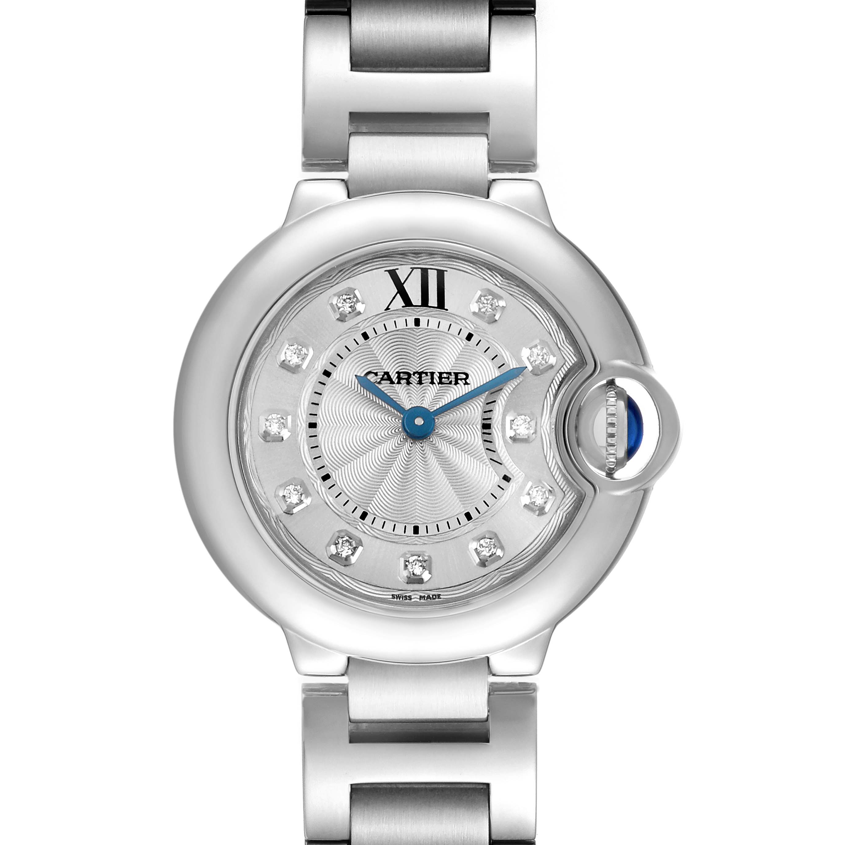 The Cartier Ballon Bleu WE902073 Women's Stainless Steel Silver Dial watch is shown from a front angle, highlighting its round face, diamond hour markers, and crown with a blue cabochon.