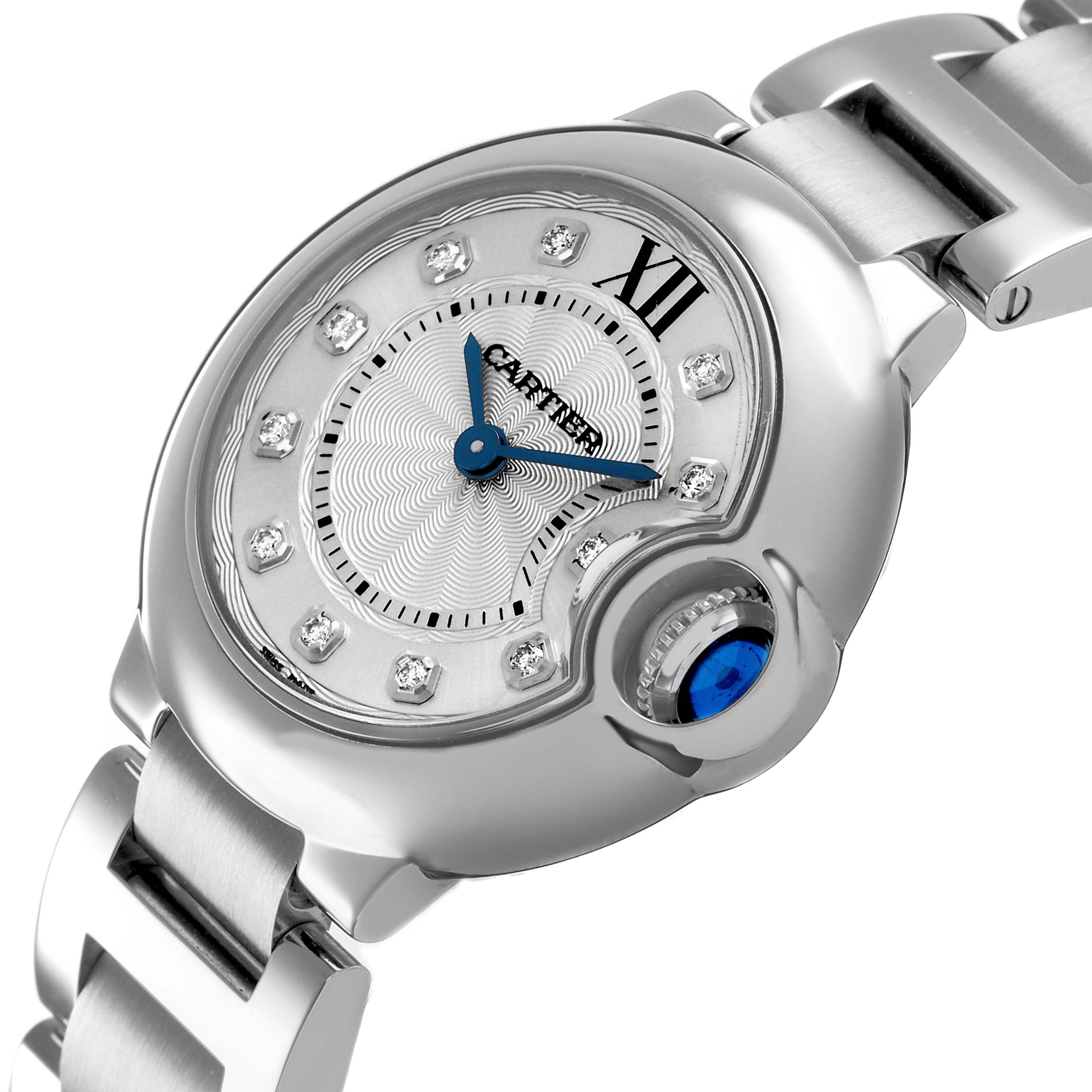 The Cartier Ballon Bleu WE902073 Women's Stainless Steel Silver Dial watch is shown at an angled side view, highlighting the crown and bracelet links.