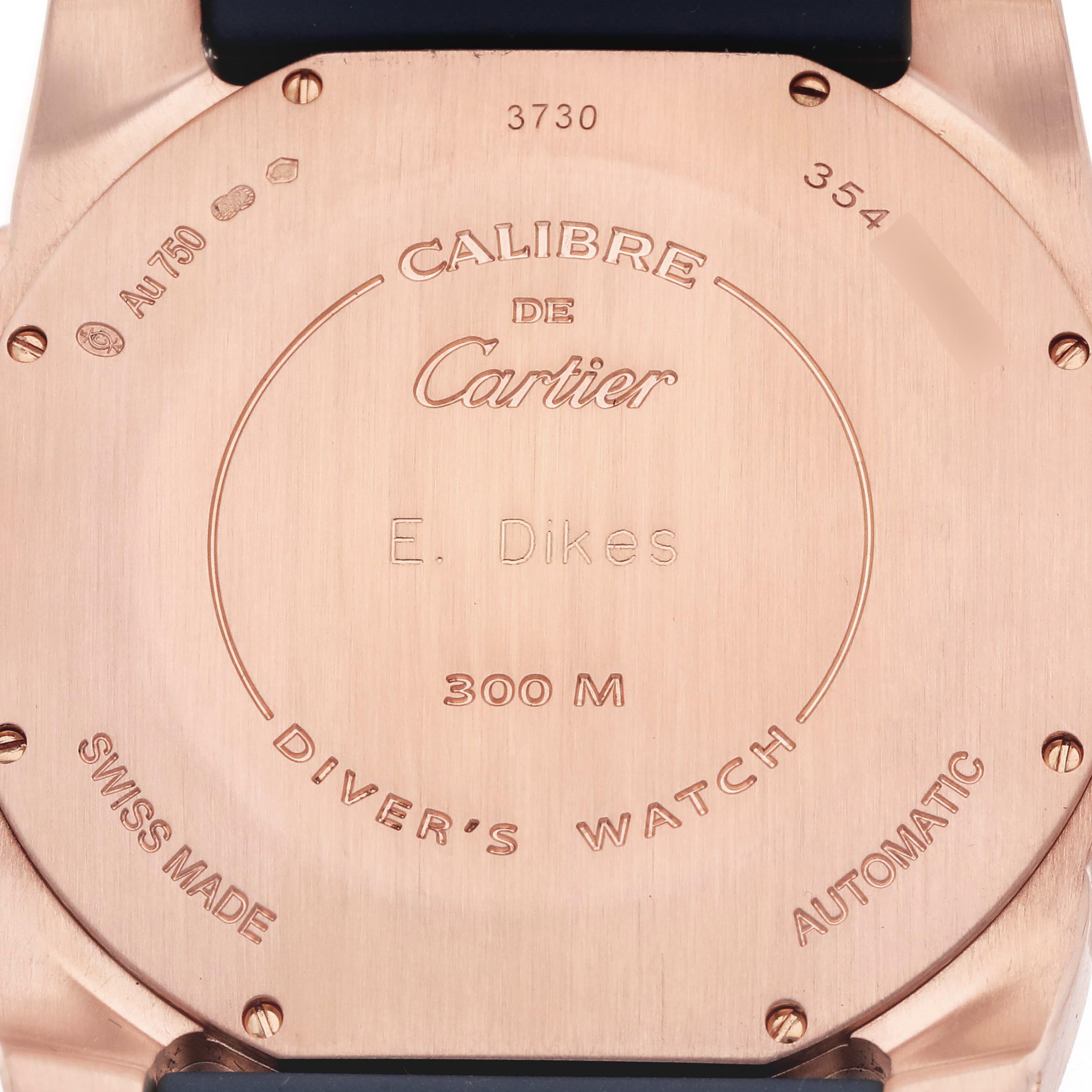 The image shows the back case of a Calibre de Cartier watch, featuring engravings and specifications.