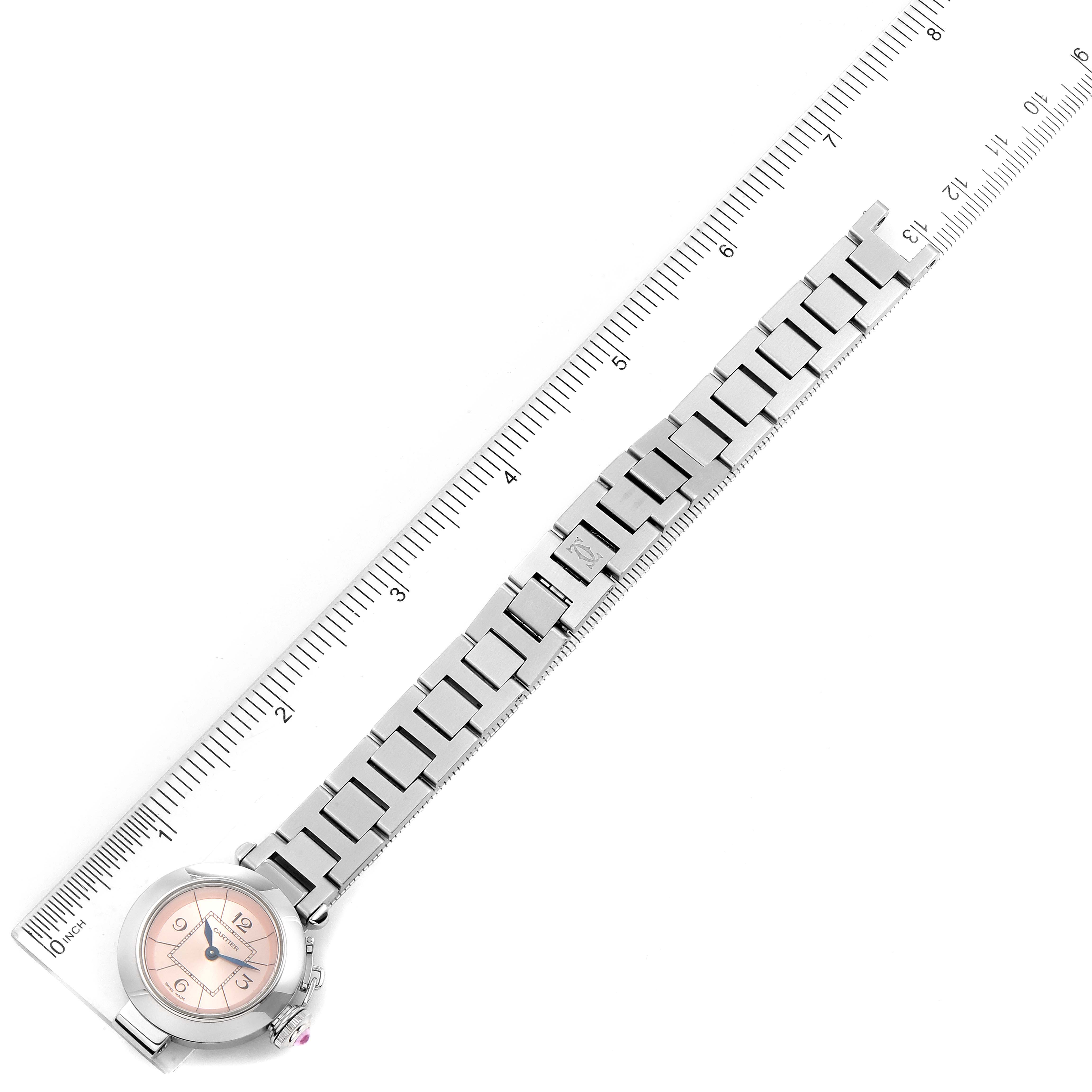 This image shows the Cartier Pasha W3140008 Women
s Stainless Steel Pink Dial W3140008 Women
s Stainless Steel Pink Dial watch laid out flat with its bracelet and a ruler for scale.