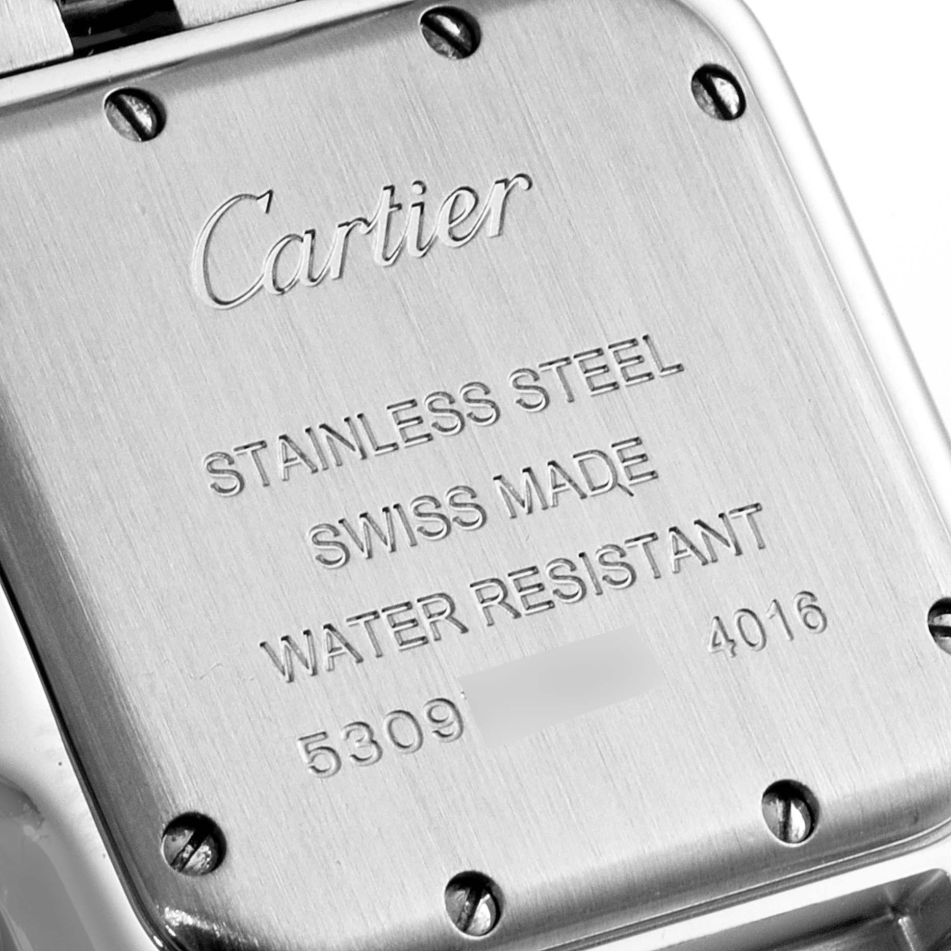 The image shows a close-up of the back case of a Cartier Panthere WSPN0007 Women
s Stainless Steel Silver Dial WSPN0007 Women
s Stainless Steel Silver Dial watch, featuring engravings that indicate material and specifications.