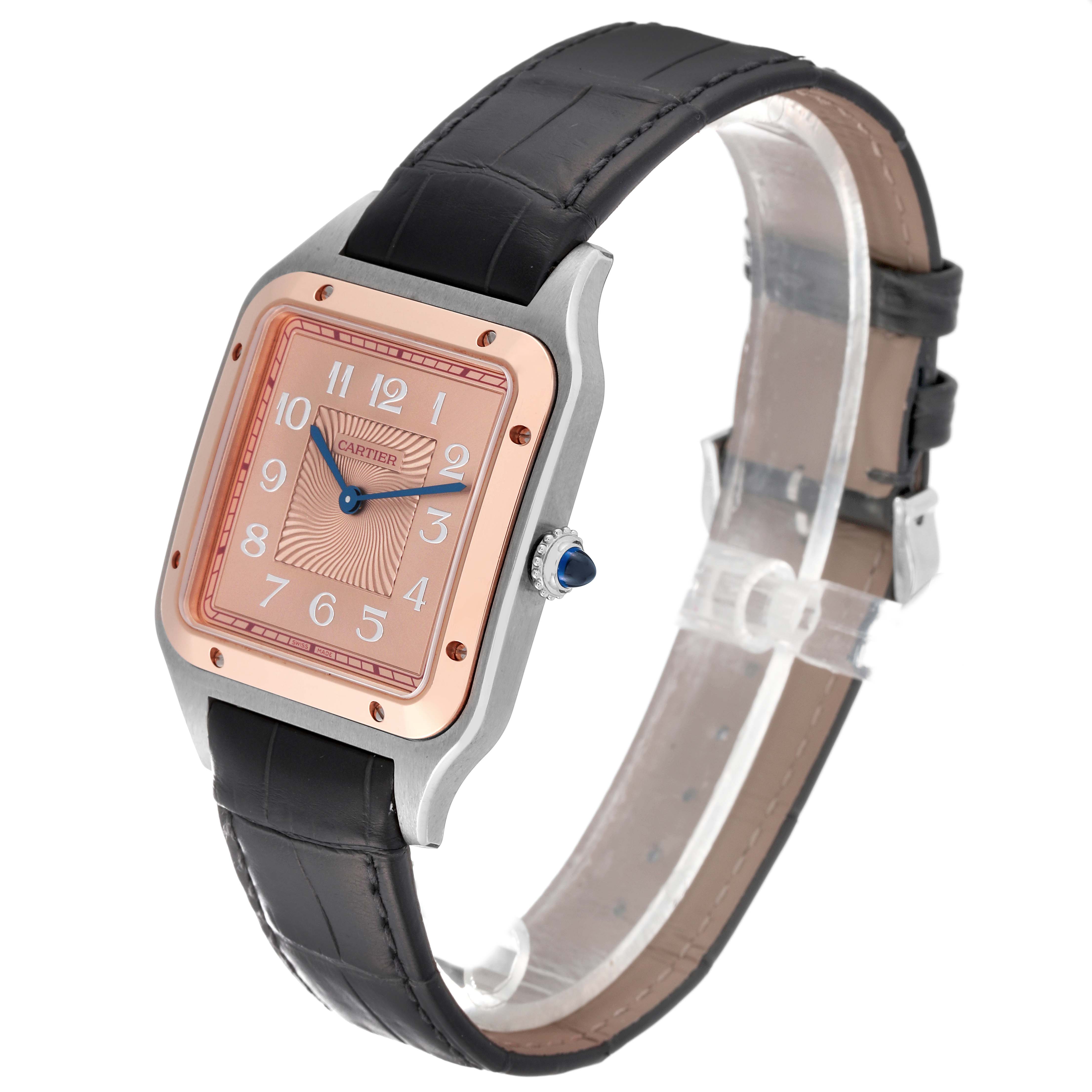 The Santos Dumont by Cartier watch is shown at a three-quarter angle, highlighting its face, bezel, and black leather strap.