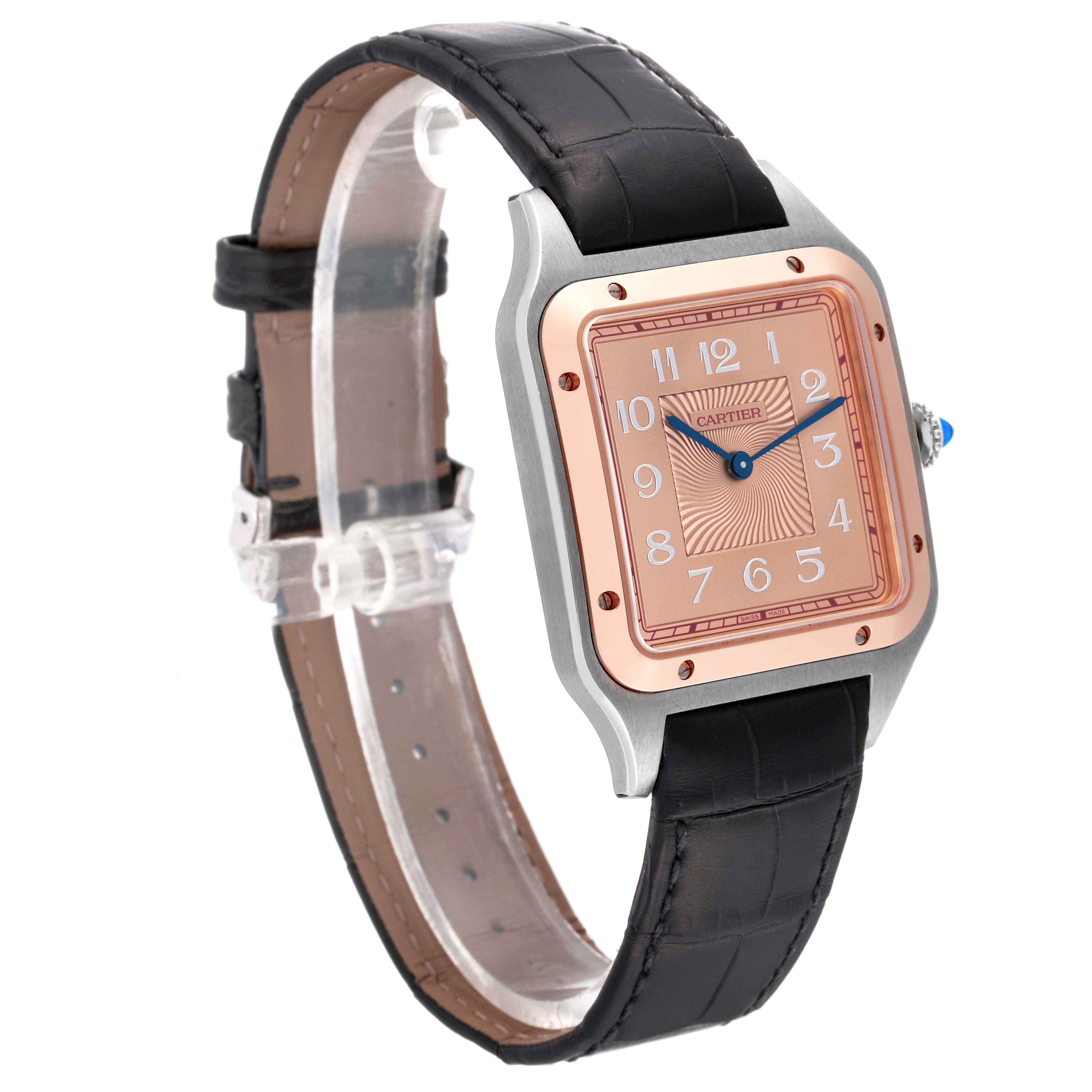 The Cartier Santos Dumont W2SA0025 Men
s Stainless Steel Pink Dial W2SA0025 Men
s Stainless Steel Pink Dial watch is shown at an angle, highlighting the face, case, and black leather strap.