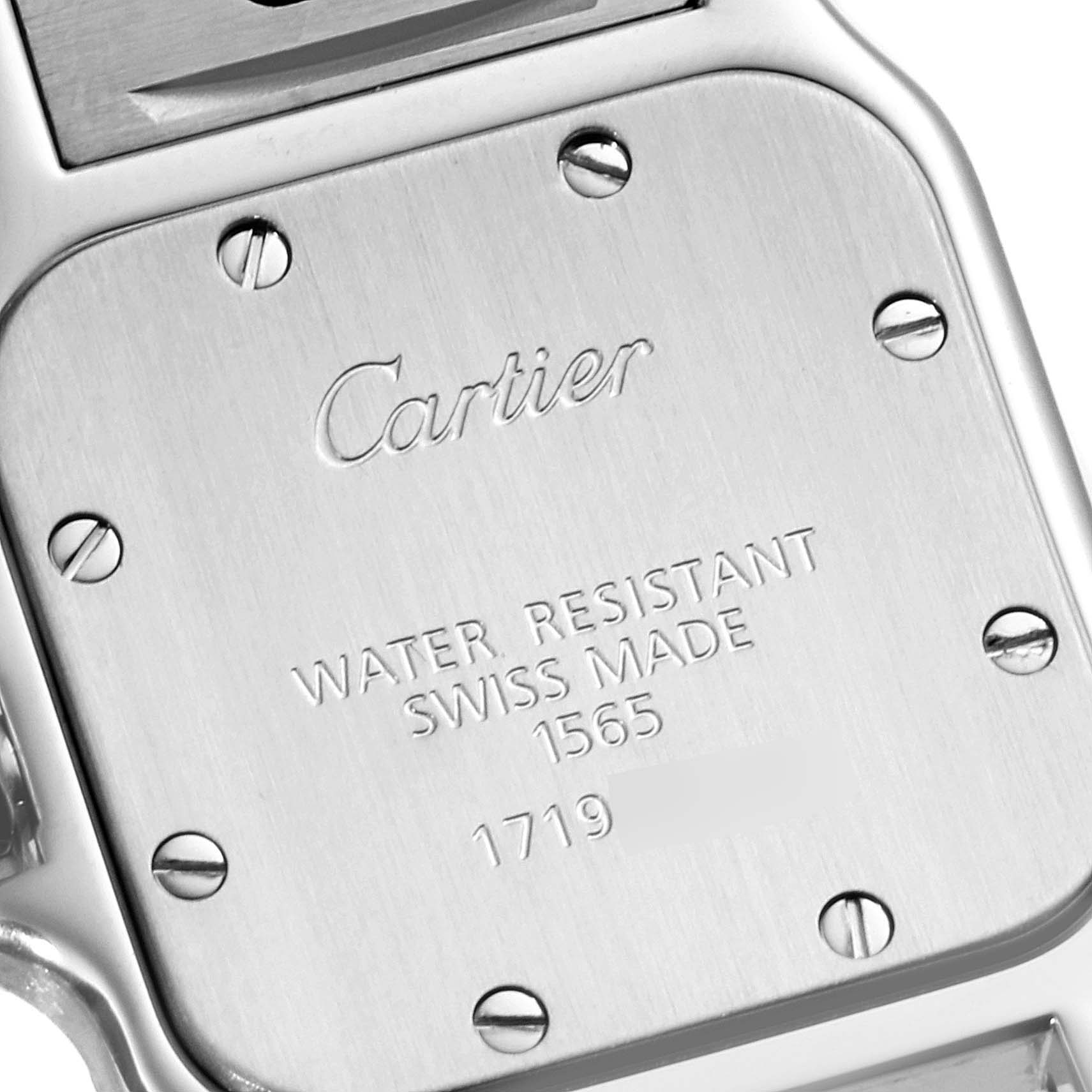 This image shows the back case of a Cartier Santos W20056D6 Women's Stainless Steel Silver Dial W20056D6 Women's Stainless Steel Silver Dial watch, highlighting the brand name, water resistance, origin, and serial numbers.