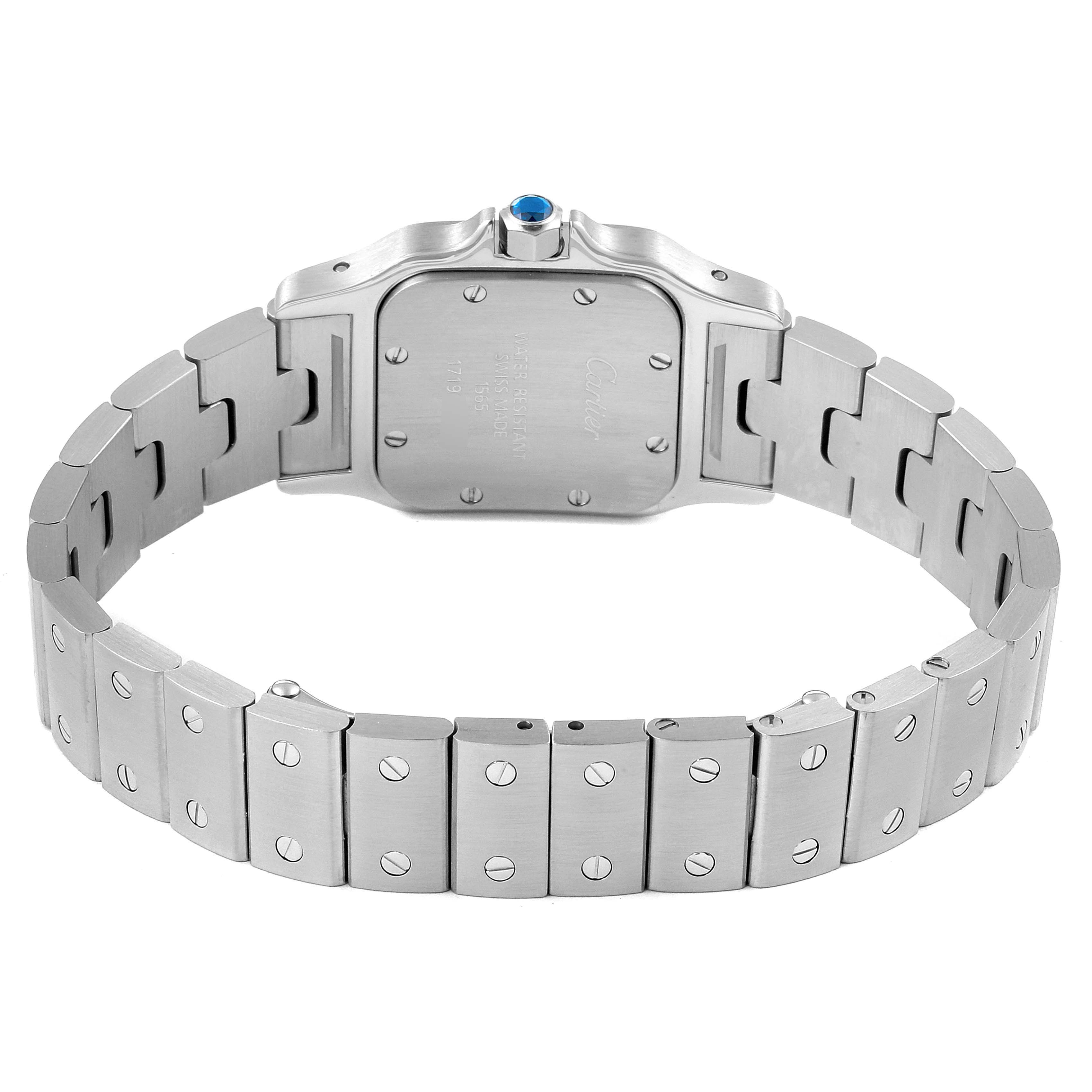 The image shows the back view of the Santos model by Cartier, highlighting its case and metal bracelet.