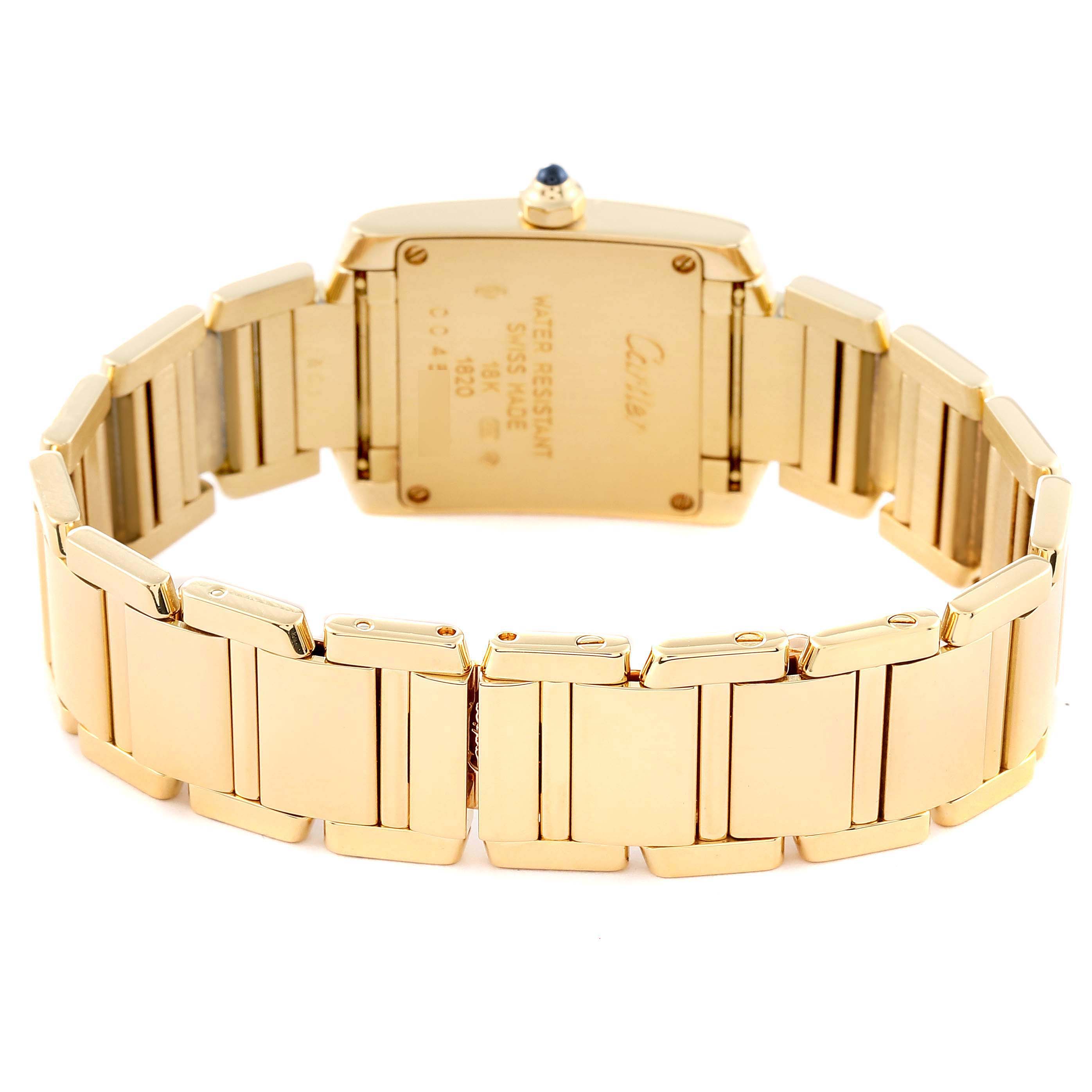 The image shows the back view of a Cartier Tank Francaise W50002N2 Women's Yellow Gold Silver Dial W50002N2 Women's Yellow Gold Silver Dial watch, highlighting its gold bracelet and case back.