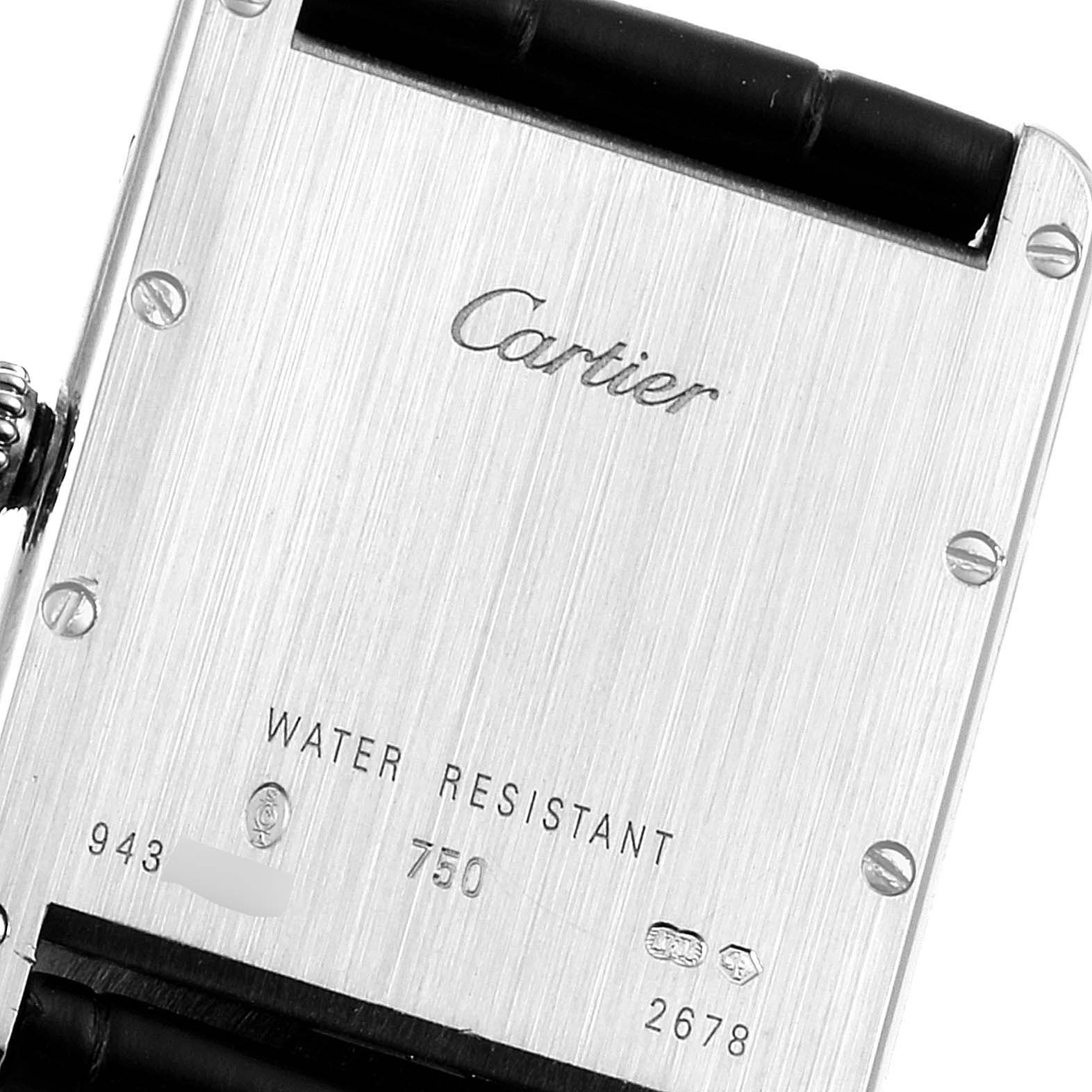 The image shows the back of the Cartier Tank Louis W1540956 Men
s White Gold Silver Dial W1540956 Men
s White Gold Silver Dial watch, detailing the brand name and specifications.