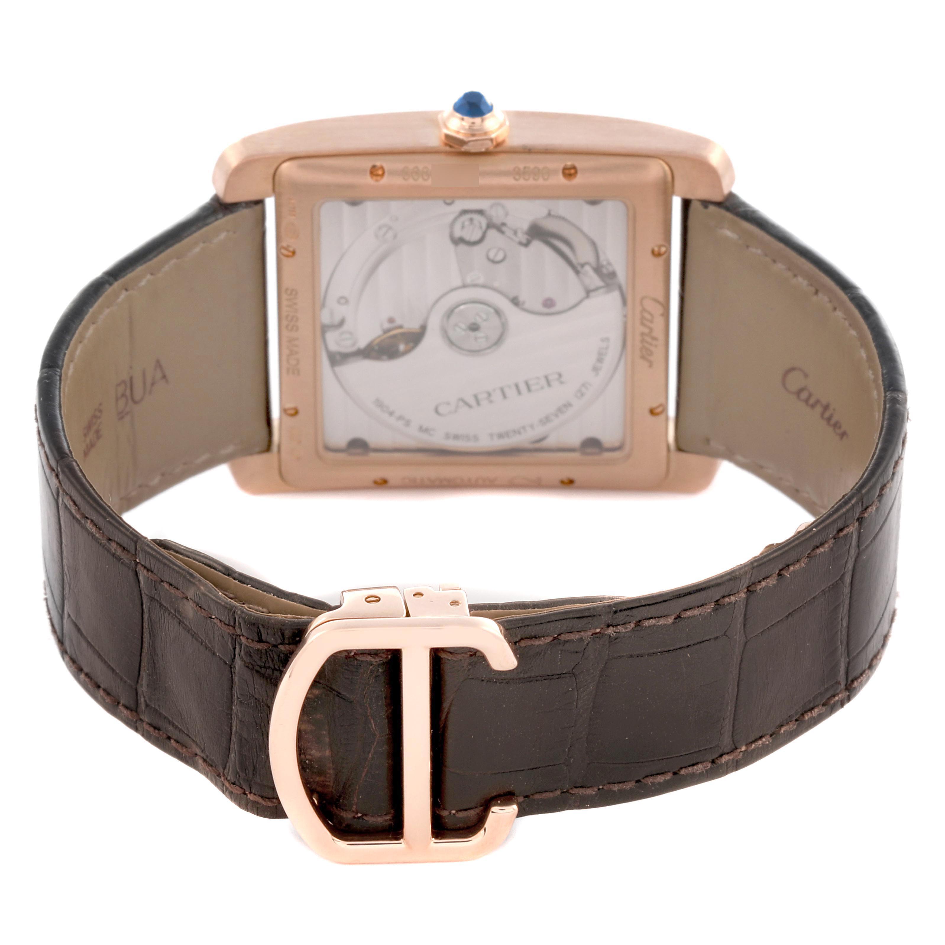 The image shows the back view of a Cartier Tank MC W5330001 Men's Rose Gold Silver Dial watch, highlighting its movement and leather strap with a metal clasp.