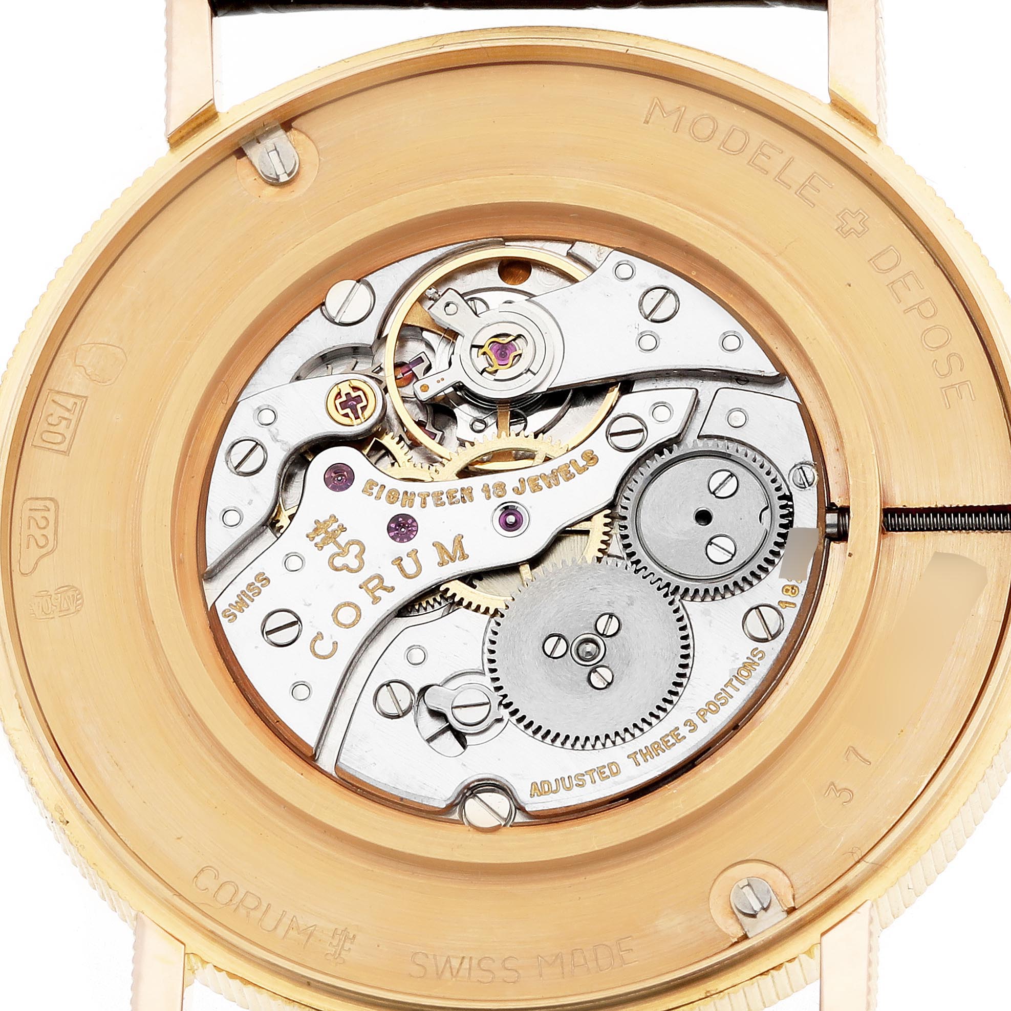 The image shows the back view of a Corum Coin Watch 4414556 Men's Yellow Gold Champagne Dial 4414556 Men's Yellow Gold Champagne Dial, highlighting its mechanical movement and intricate gears.