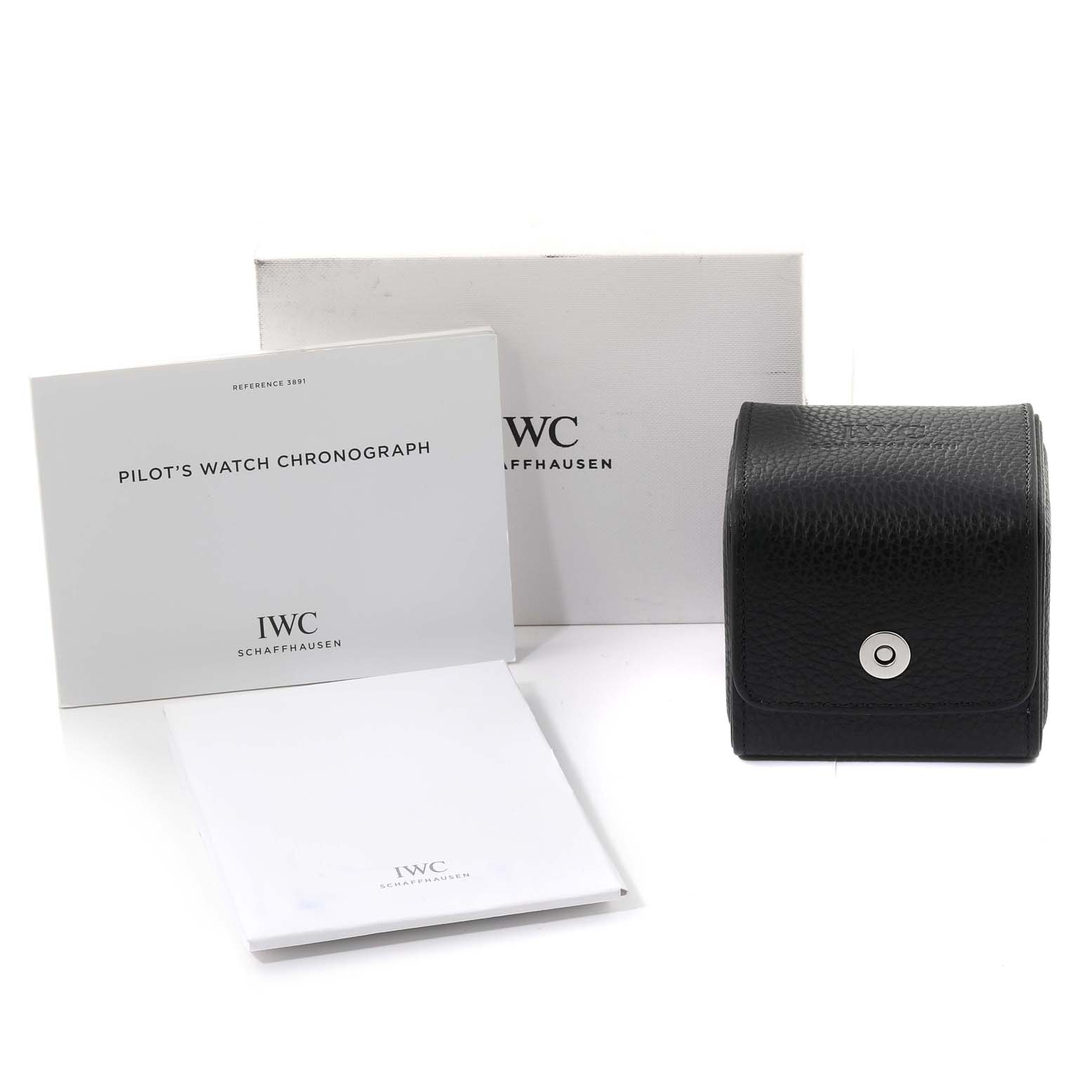 The image shows an IWC Pilot IW389105 Men's Ceramic Black Dial IW389105 Men's Ceramic Black Dial's Watch box, instruction manuals, and a black leather carrying case.