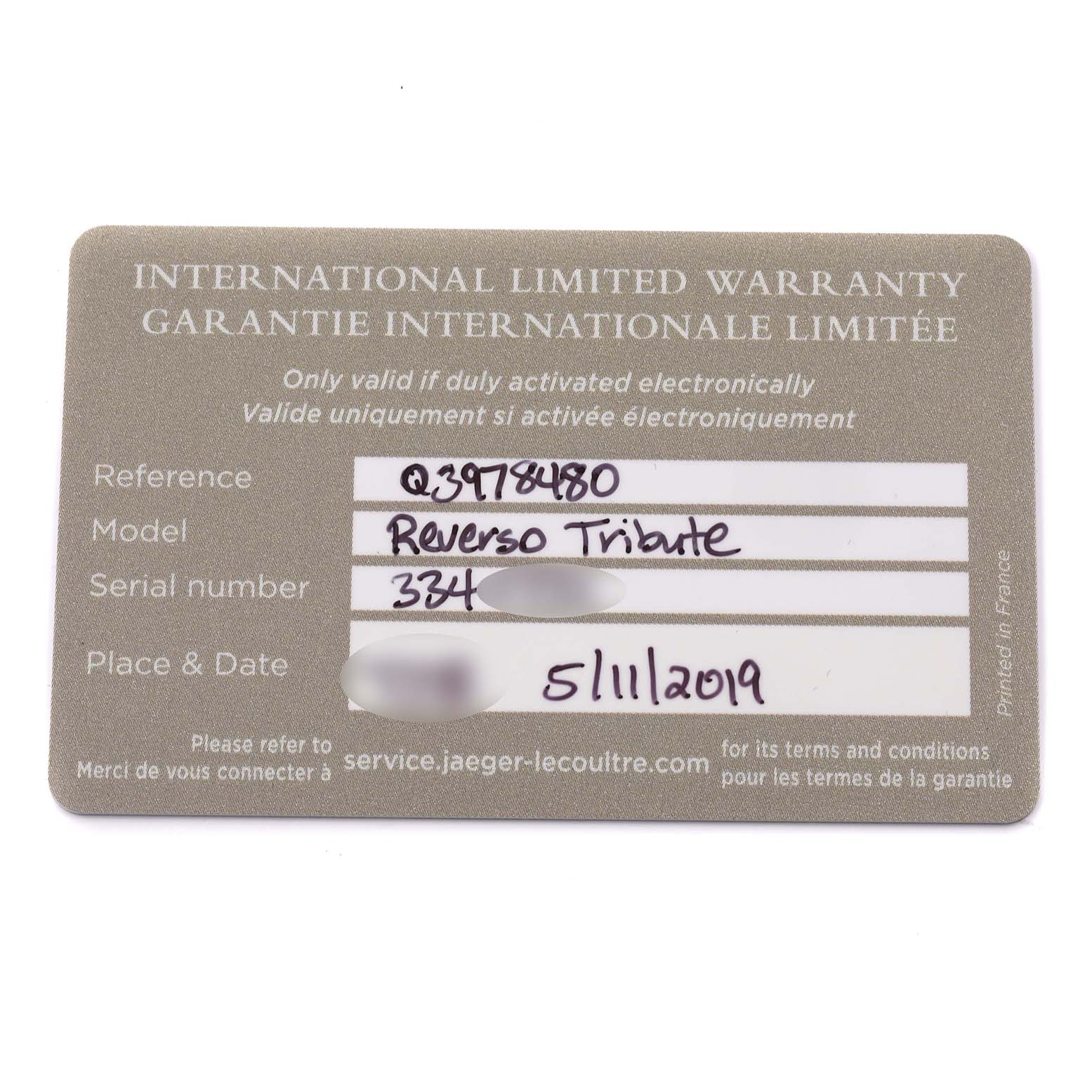 The image shows a warranty card for the Jaeger LeCoultre Reverso Q3978480 Men's Stainless Steel Blue Dial Q3978480 Men's Stainless Steel Blue Dial model, displaying reference, model, serial number, and date.