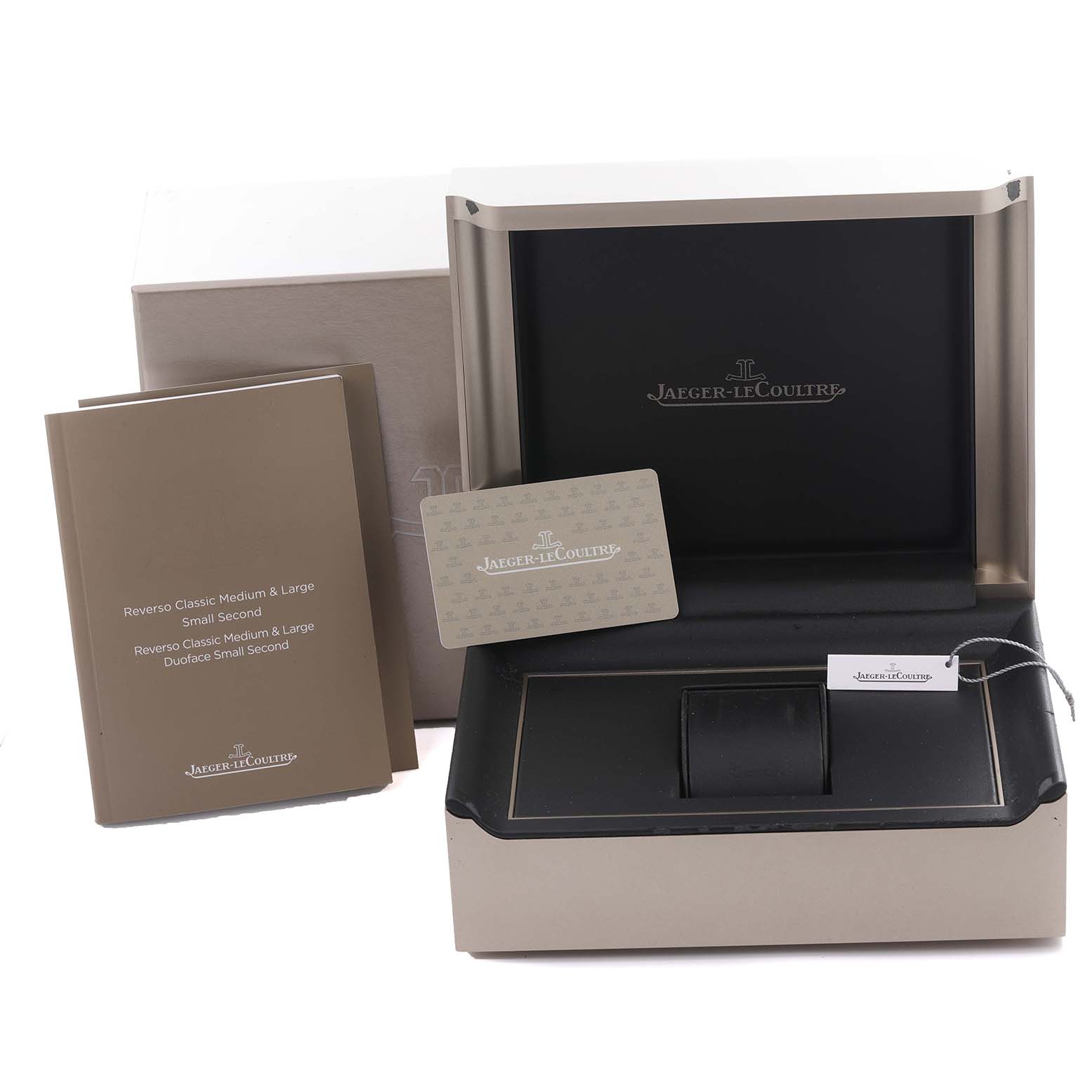 The image shows an open box for the Jaeger LeCoultre Reverso Q3978480 Men's Stainless Steel Blue Dial Q3978480 Men's Stainless Steel Blue Dial watch, with manuals and a warranty card visible.