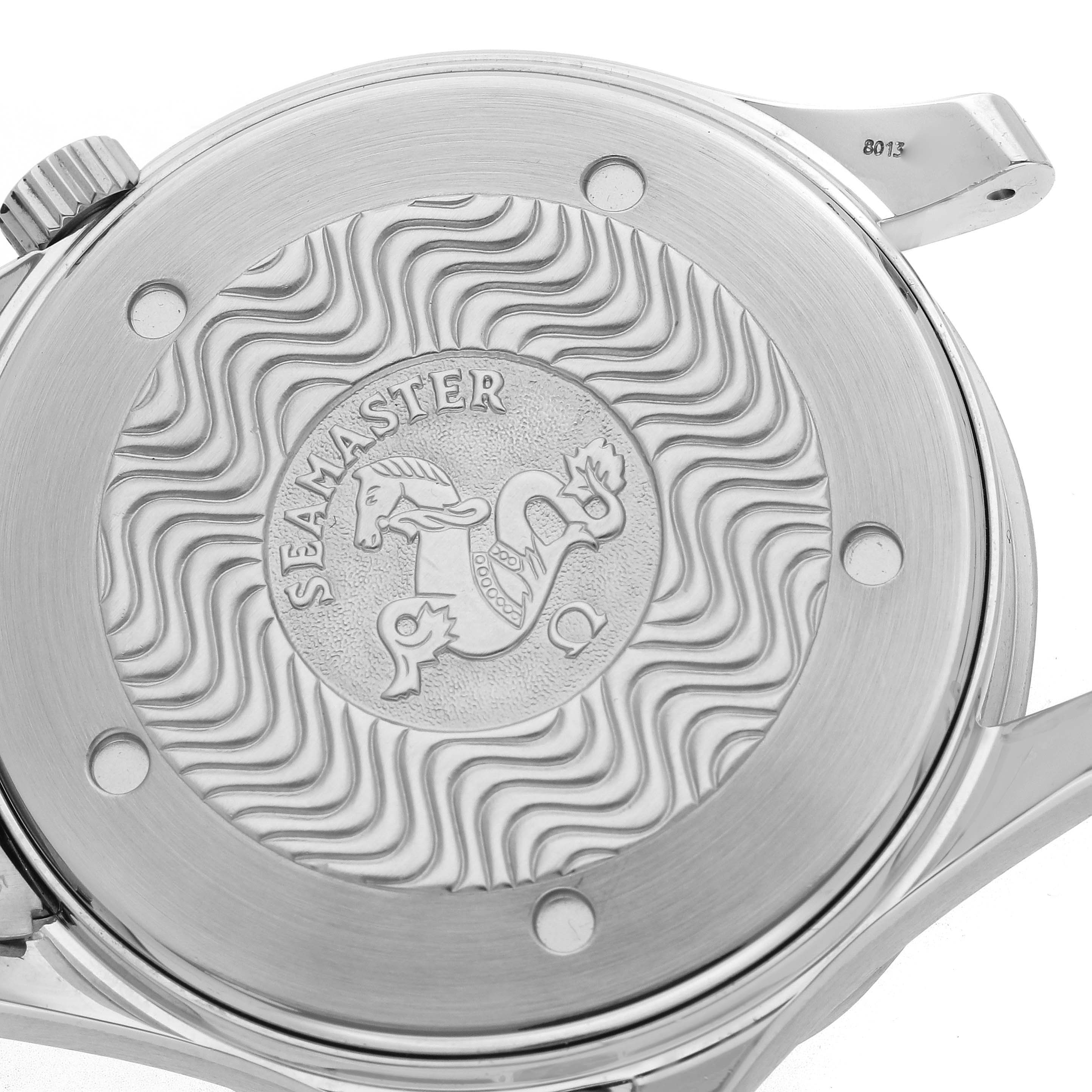 The image shows the back of the Omega Seamaster 2531.80.00 Men
s Stainless Steel Blue Dial 2531.80.00 Men
s Stainless Steel Blue Dial watch, featuring its embossed emblem and wave pattern.